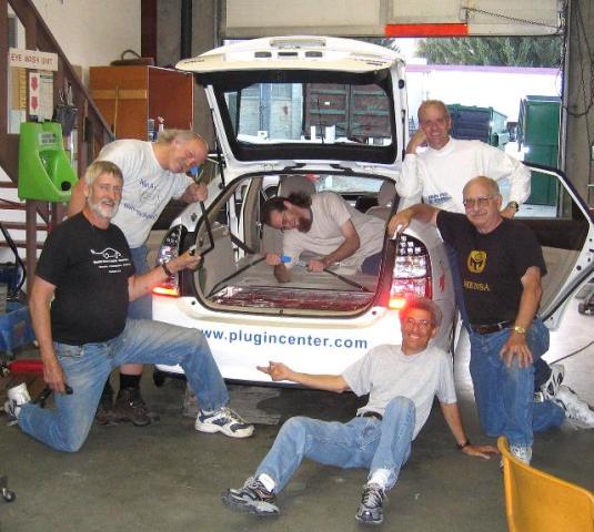 Helping convert the Prius were, from the left: Steve Lough, Rich Rudman, Ryan Fulcher (in car), Jim White, Blake Murray, and Ron Johnston-Rodriguez (sitting). Other volunteers not pictured include: Mike Brogan, Randy Brooks, Larry Epperson, Doug Janke, Jake Lodato, and Aimee Pope.