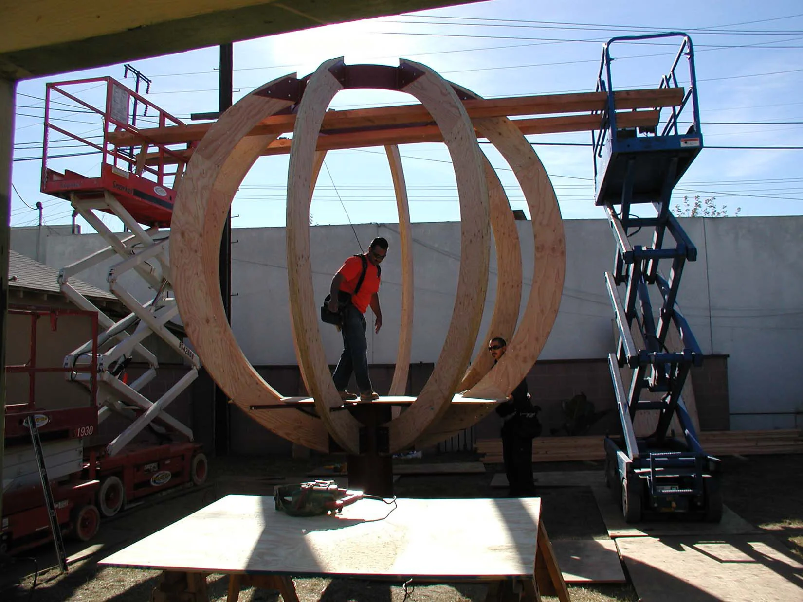 Plywood "glulam" and steel frame. 