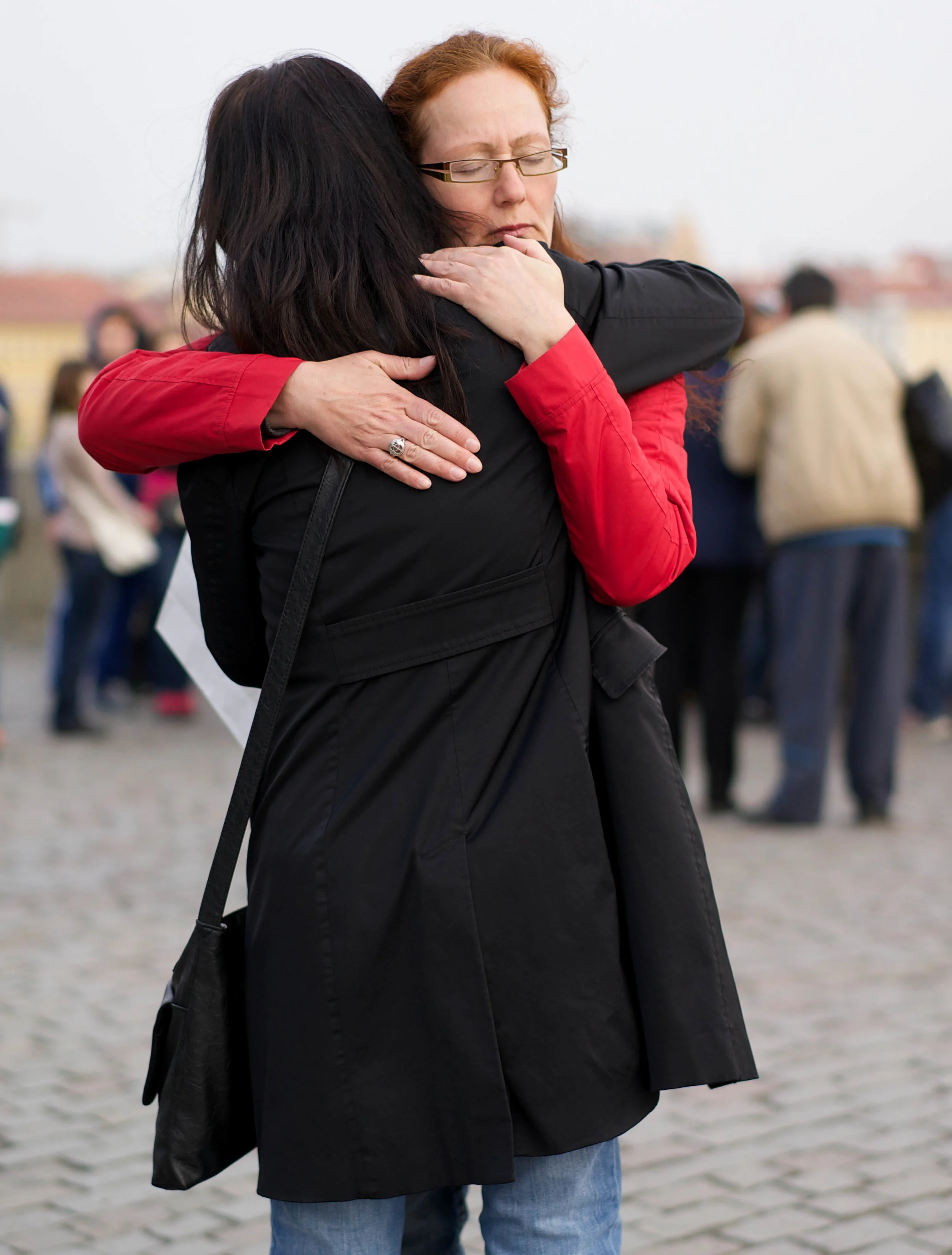 Sisters hugging on the Charles Bridge - Prague