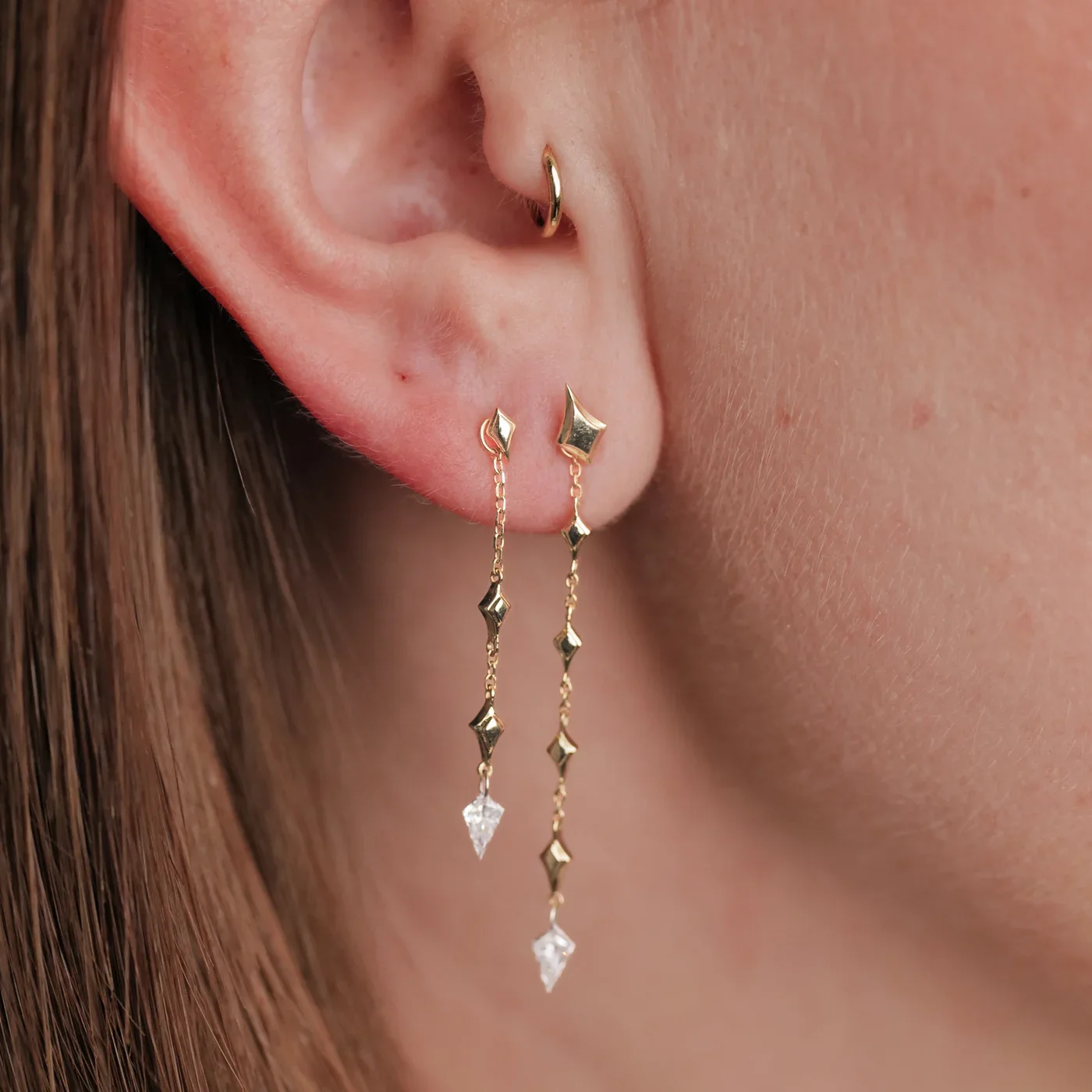 fl_earrings_northstarkitedangle_yg_model_solo_2.webp