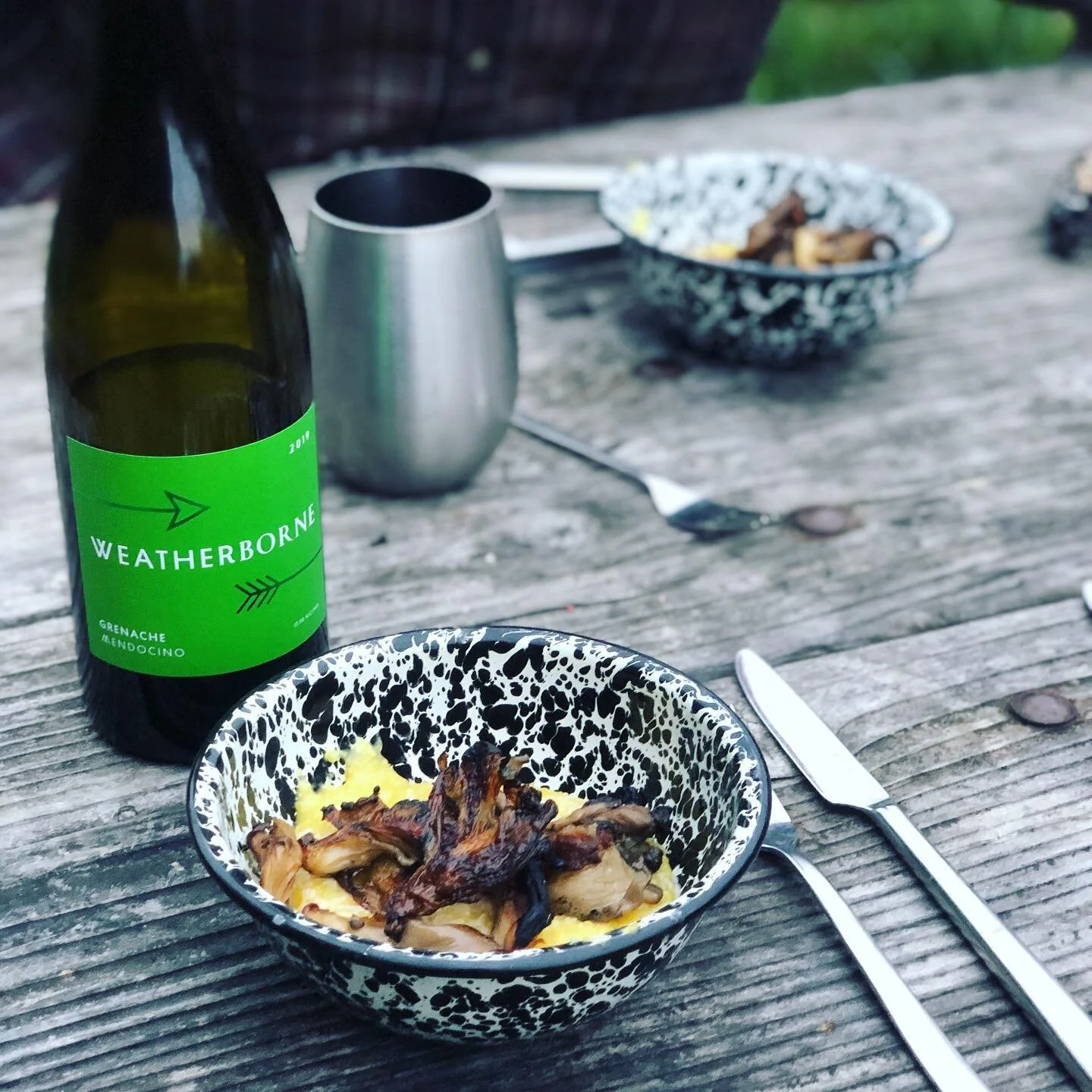 Camping cuisine: Grenache paired with polenta, a shaving Gouda, a drizzle of olive oil and topped with fire-roasted oyster mushrooms from @forest_people_mushrooms #gourmetcamping #grenache #airstreamlife