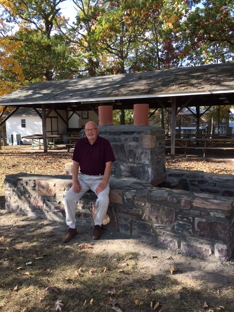 Cottage owner, Larry Landes, admiring the restoration of the Fireplace, at the Pavilion.