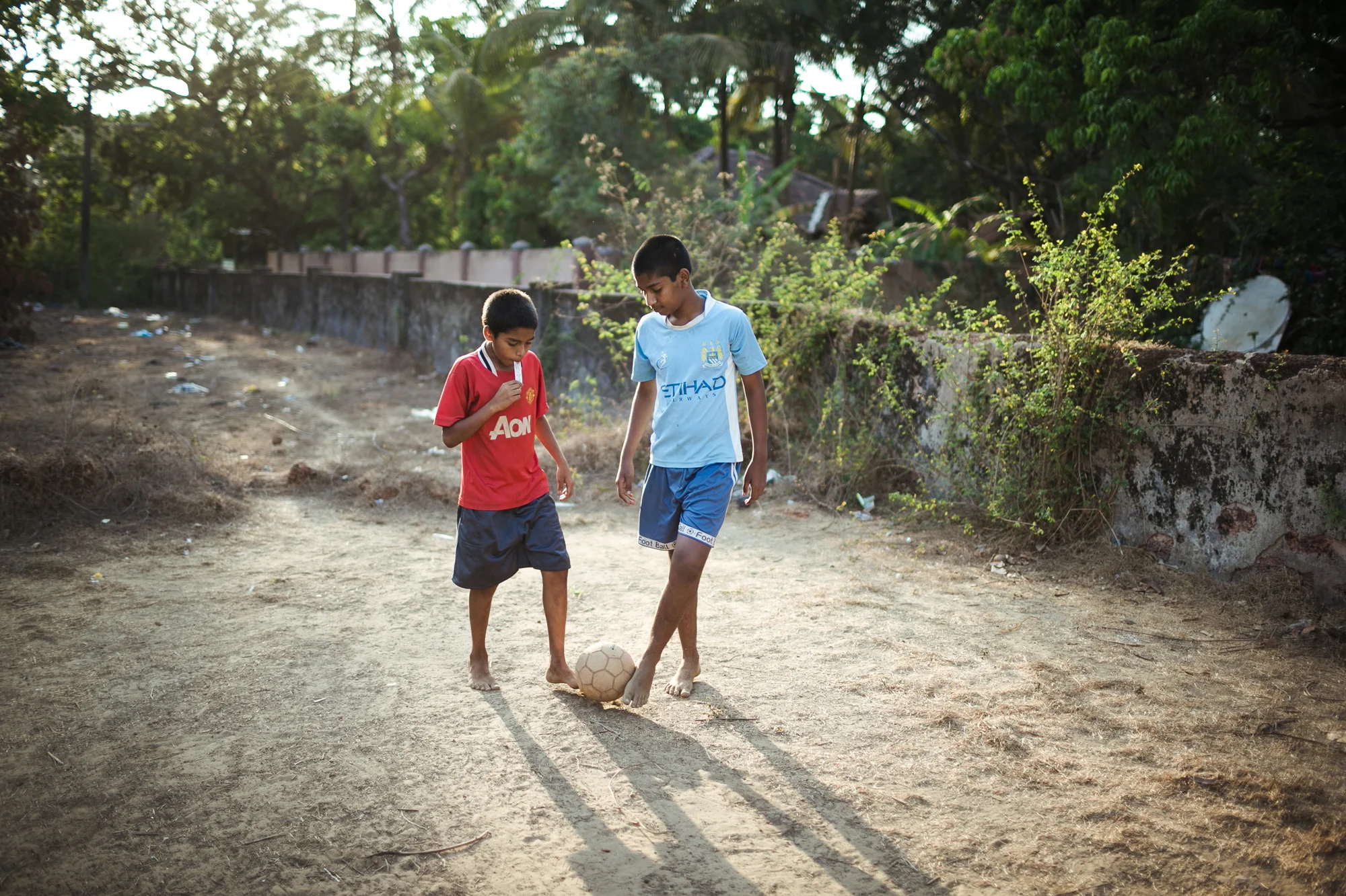 Kids playing football in Goa, India.