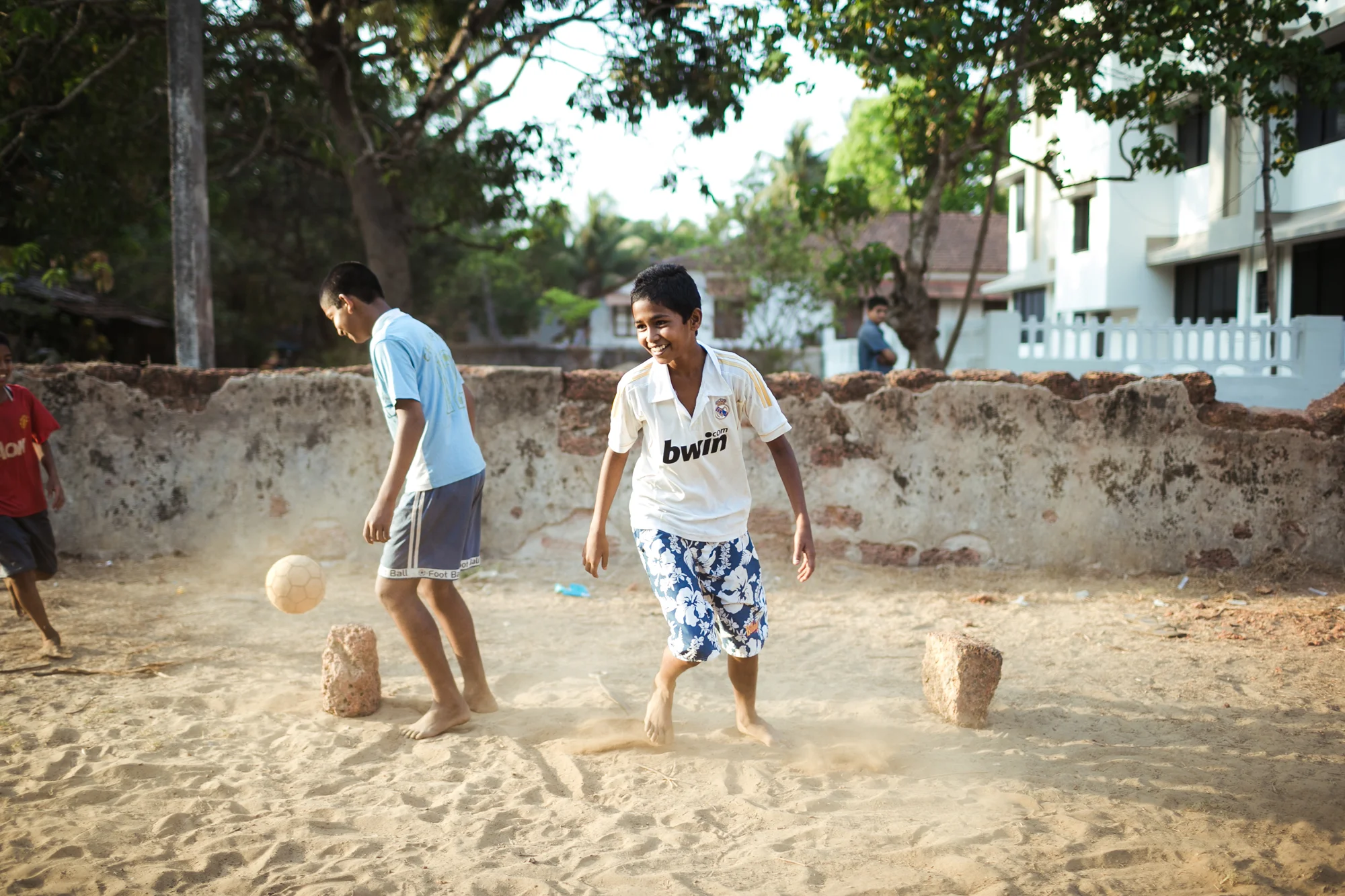 Kids playing football in Goa, India.
