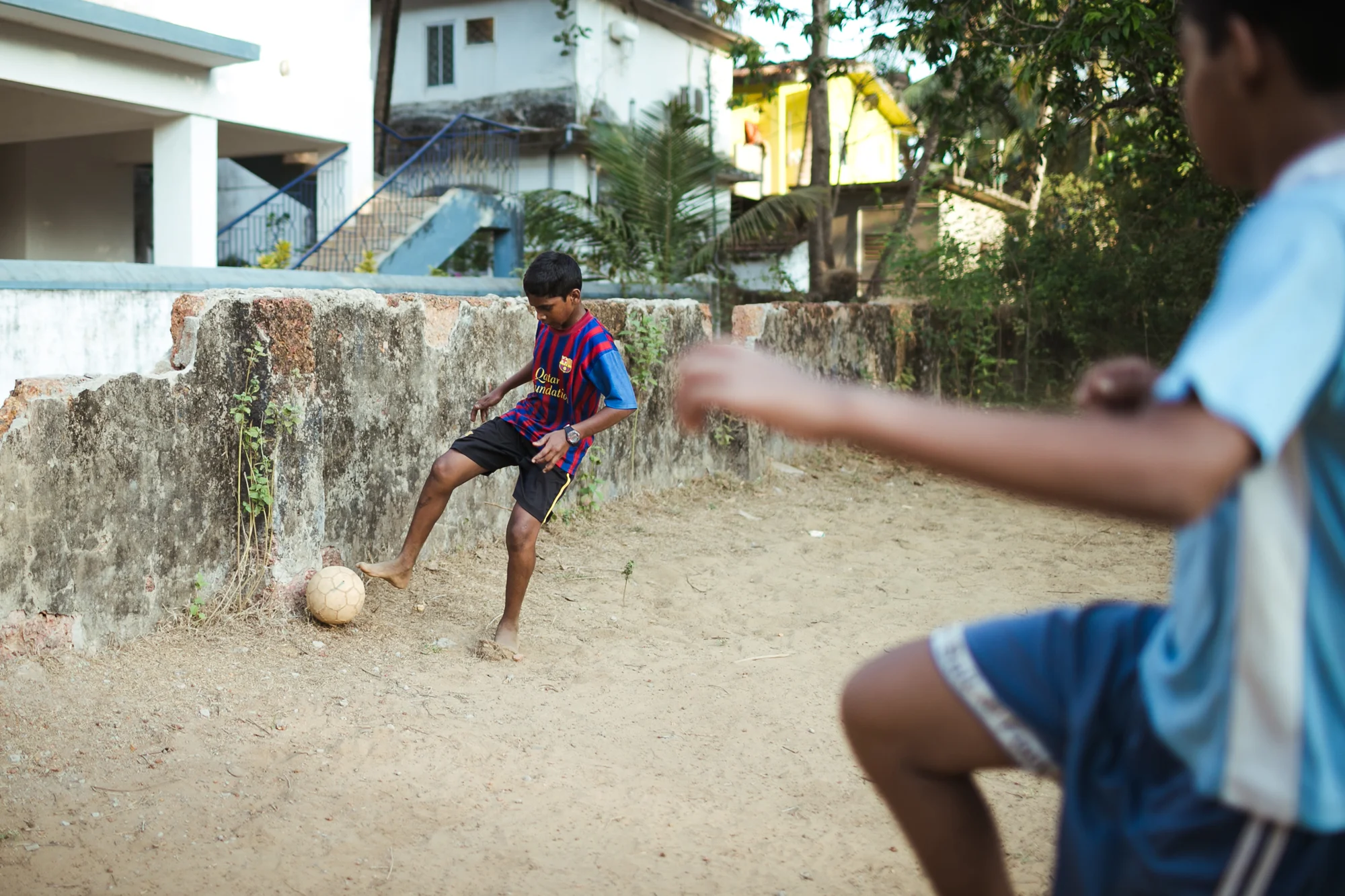 Kids playing football in Goa, India.