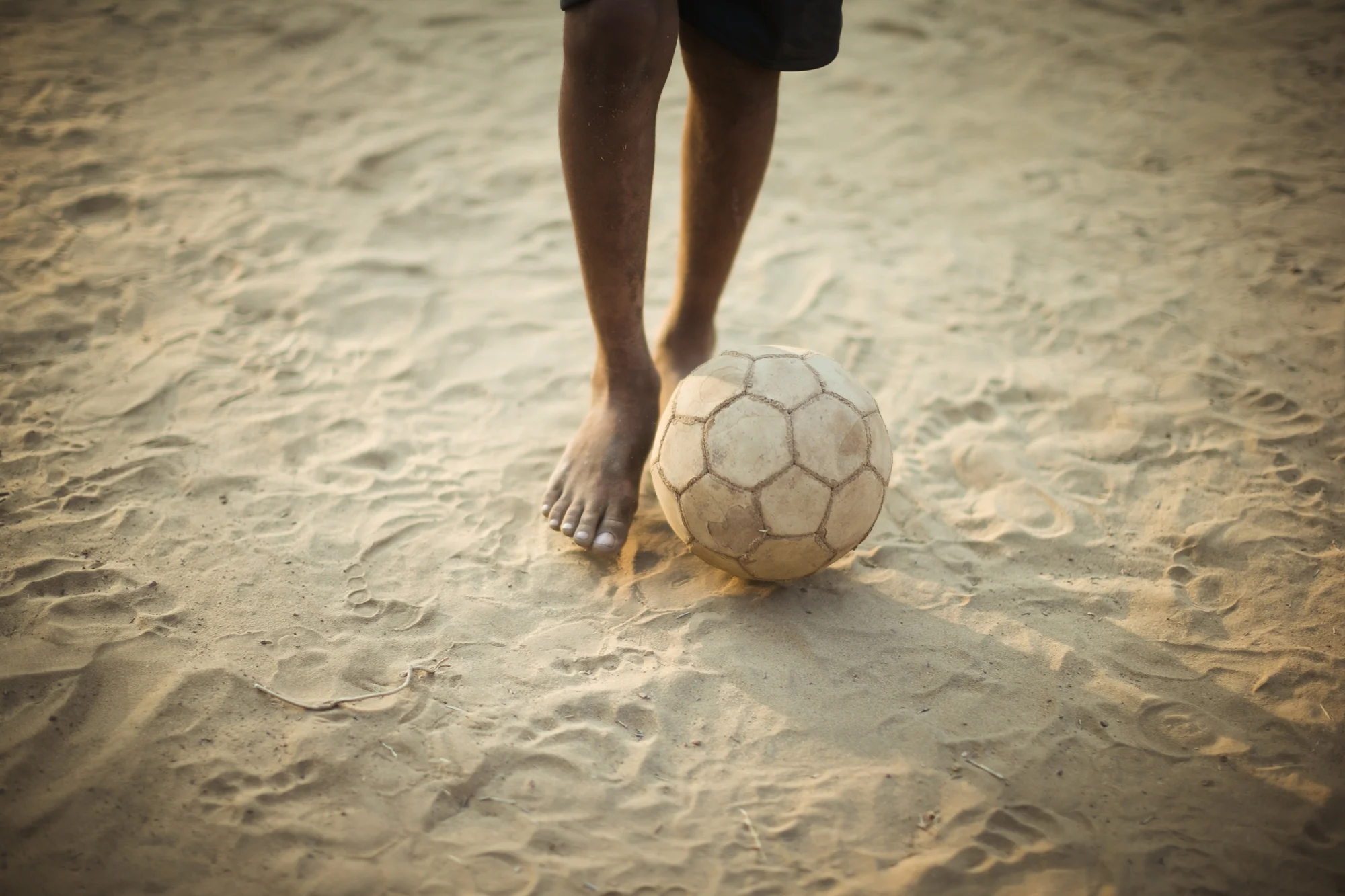 Kids playing football in Goa, India.