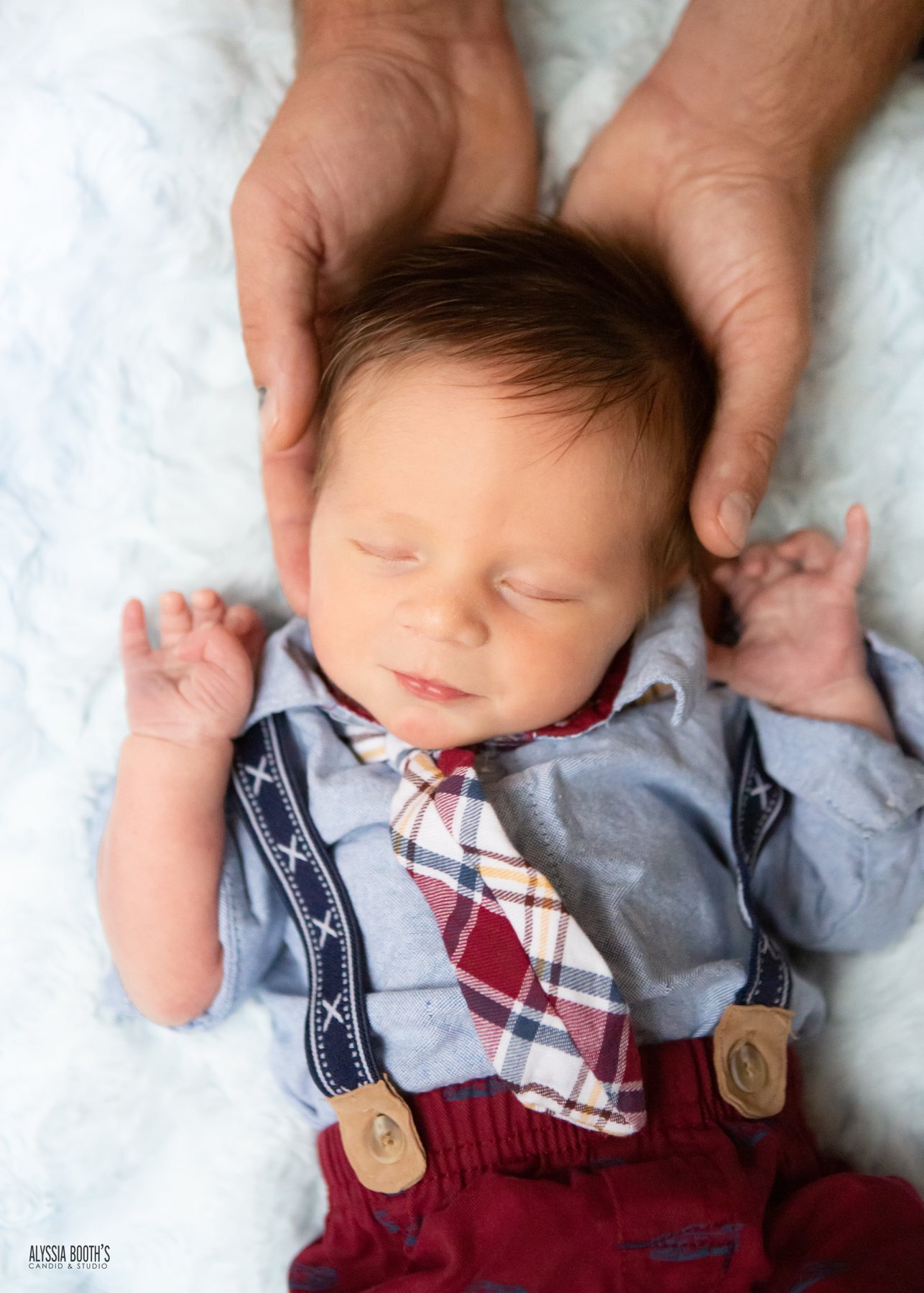 Newborn in Dads hands.jpg