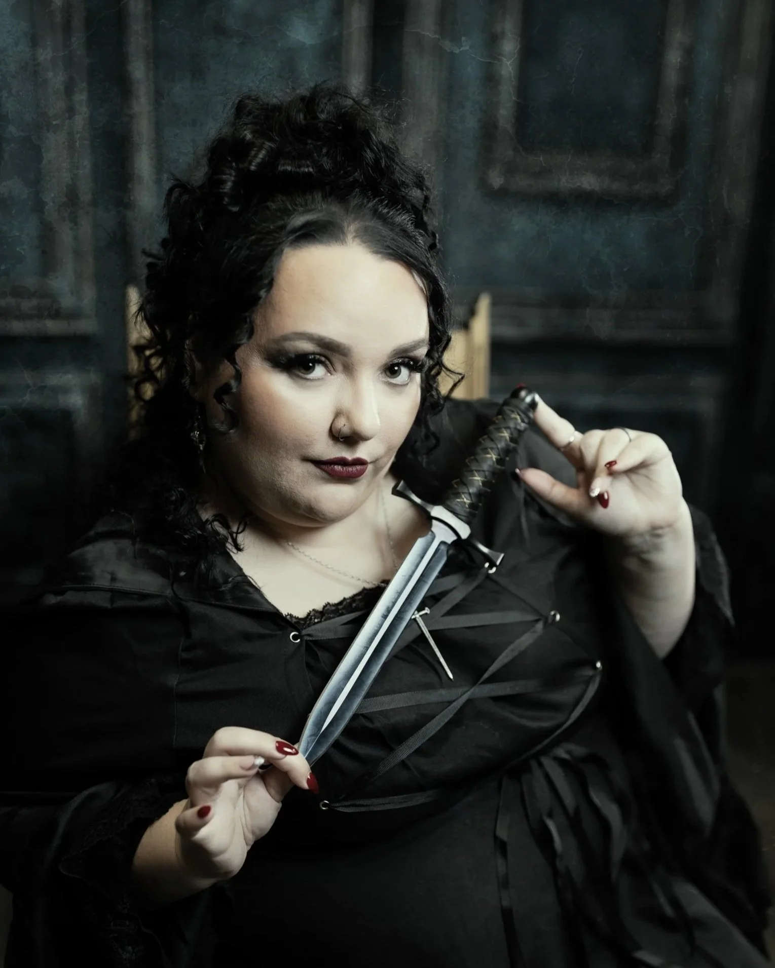 Author with a Dagger in Studio photoshoot Michigan Photo Studio Women owned businesses