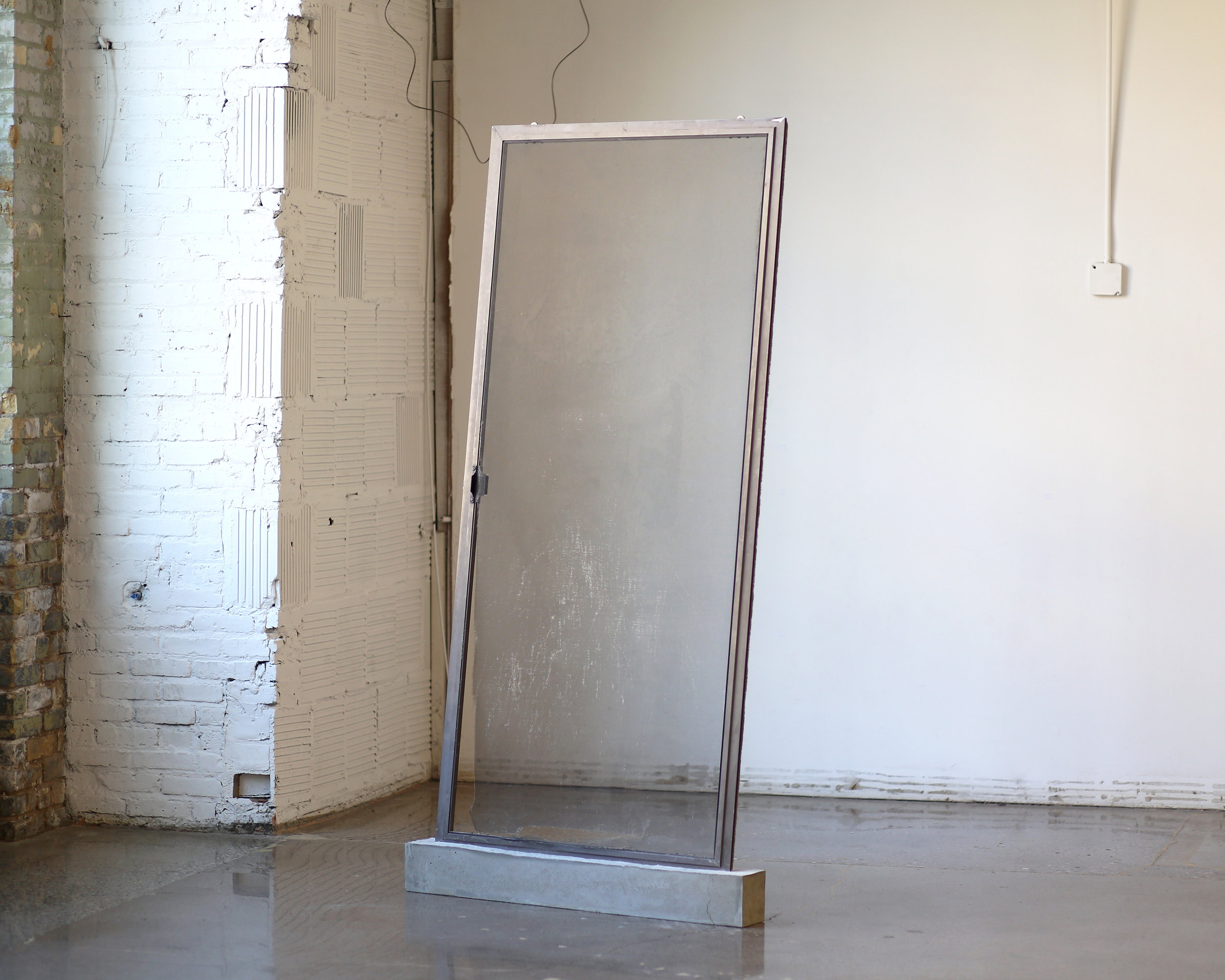   Untitled  Aluminum sliding door and concrete 85” x 43” x 5” 2018 