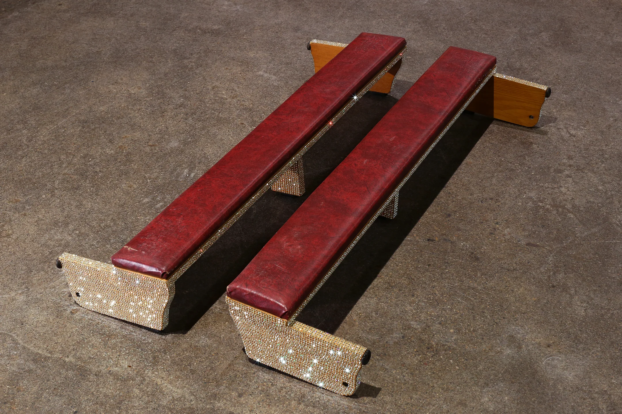 Untitled (church kneelers) Swarovski crystals on leather bond oak Roman Catholic pew kneelers Dimensions variable as set / 42” x 10” x 7” individually 2019