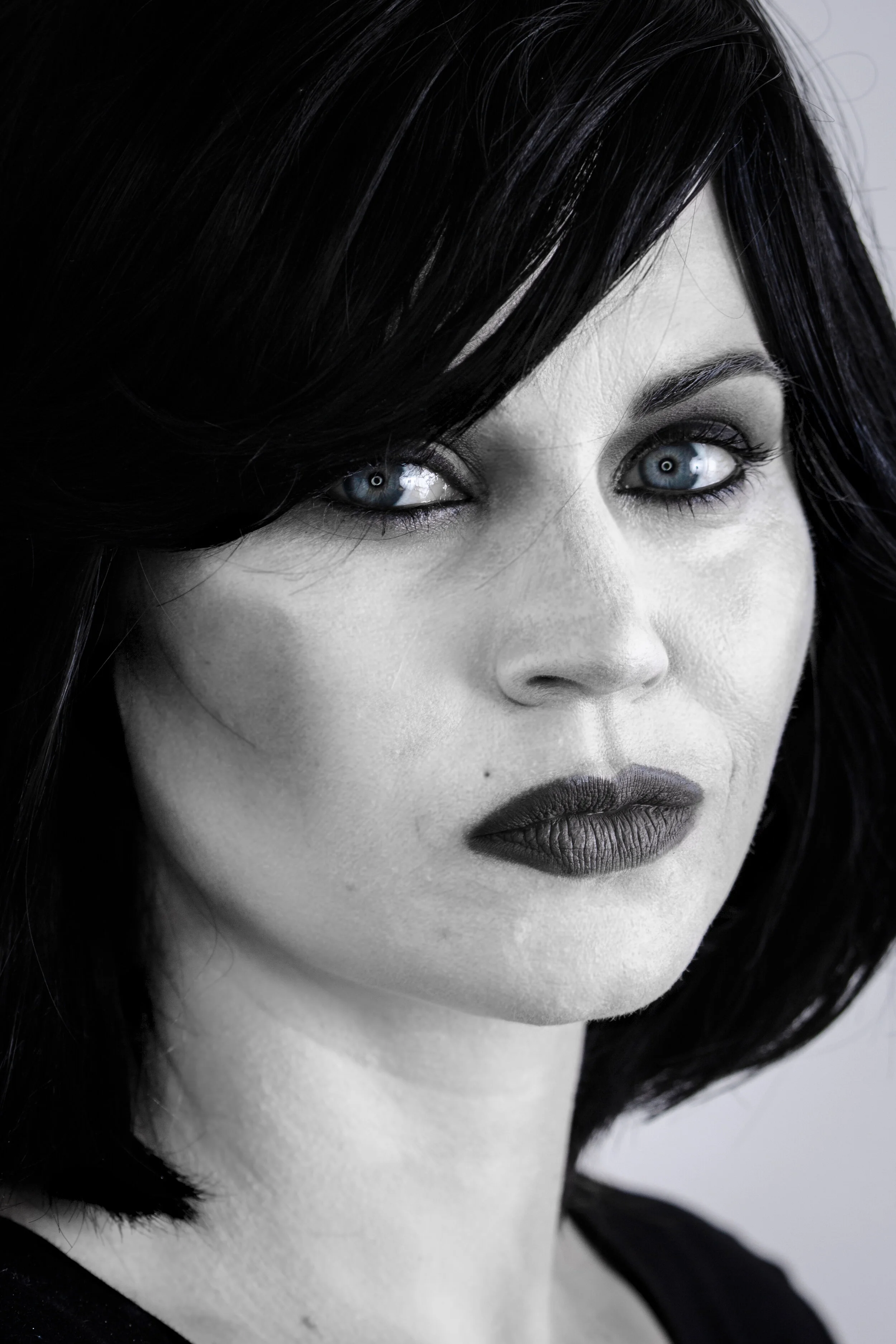 This is NOT a black and white photo. This is all black and white makeup. Look at her eyes.