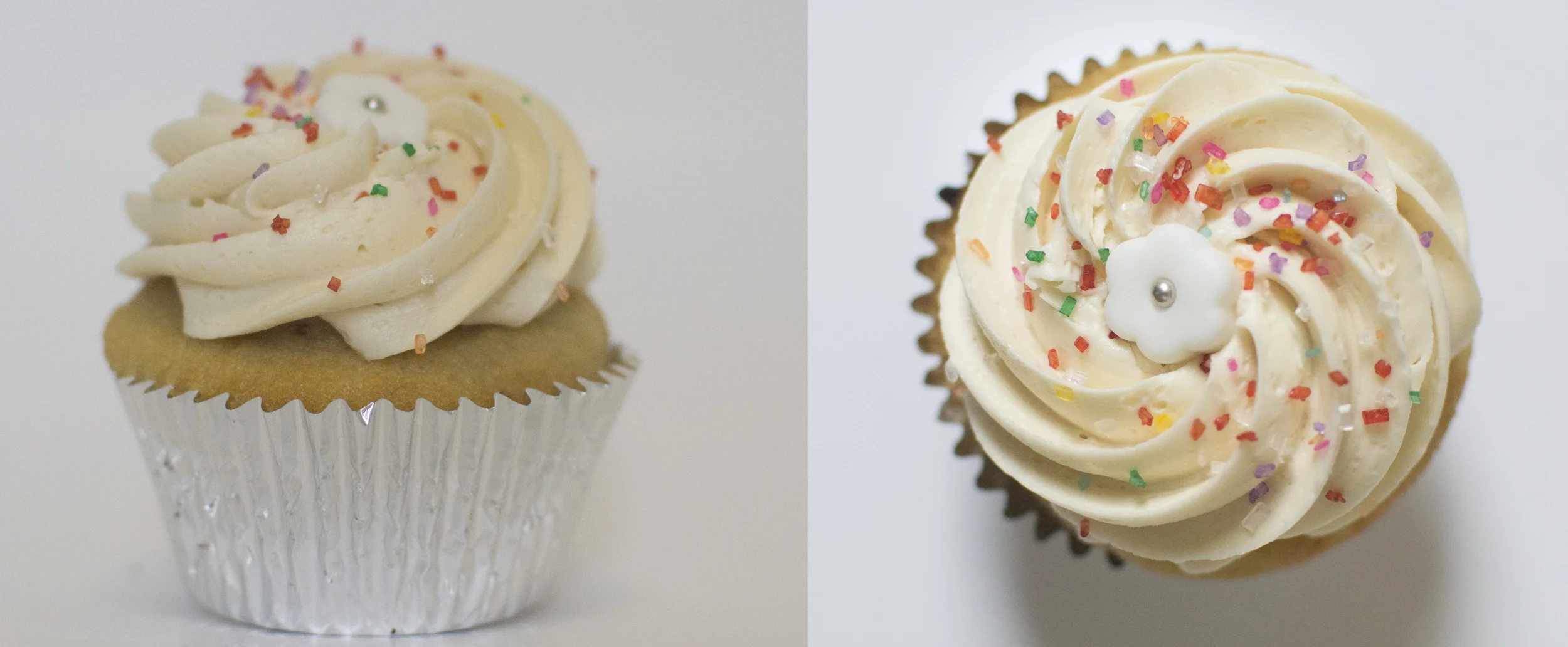 Vanilla - Our moist vanilla cake topped with vanilla buttercream, sprinkles, and a white fondant flower topper.