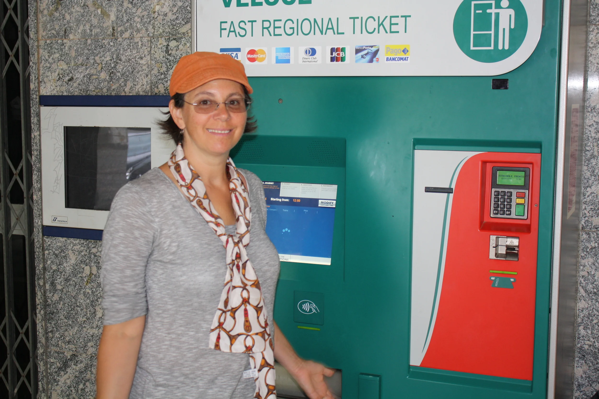 My mom in front of the ticket machine that took 30 minutes to work. 