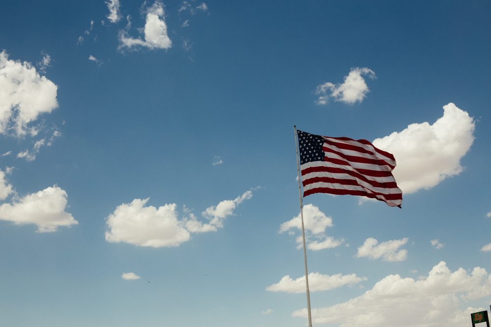 An American flag waves proudly over a Tucson, AZ business.