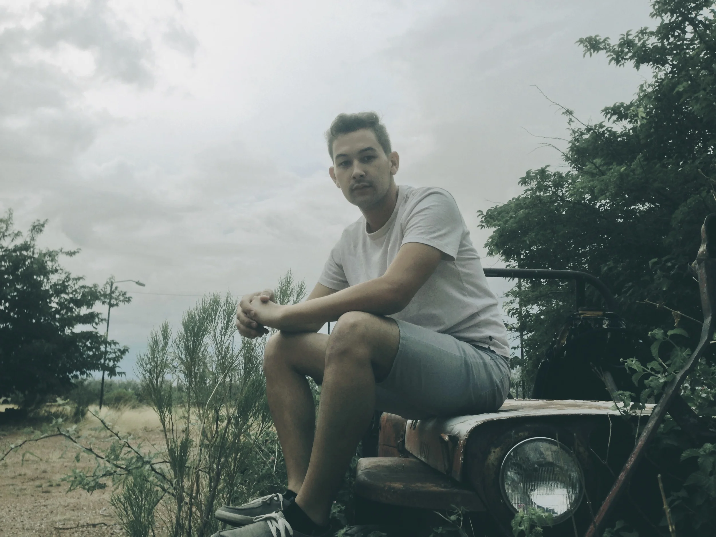 Perched on the hood of my grandfather's old jeep. 