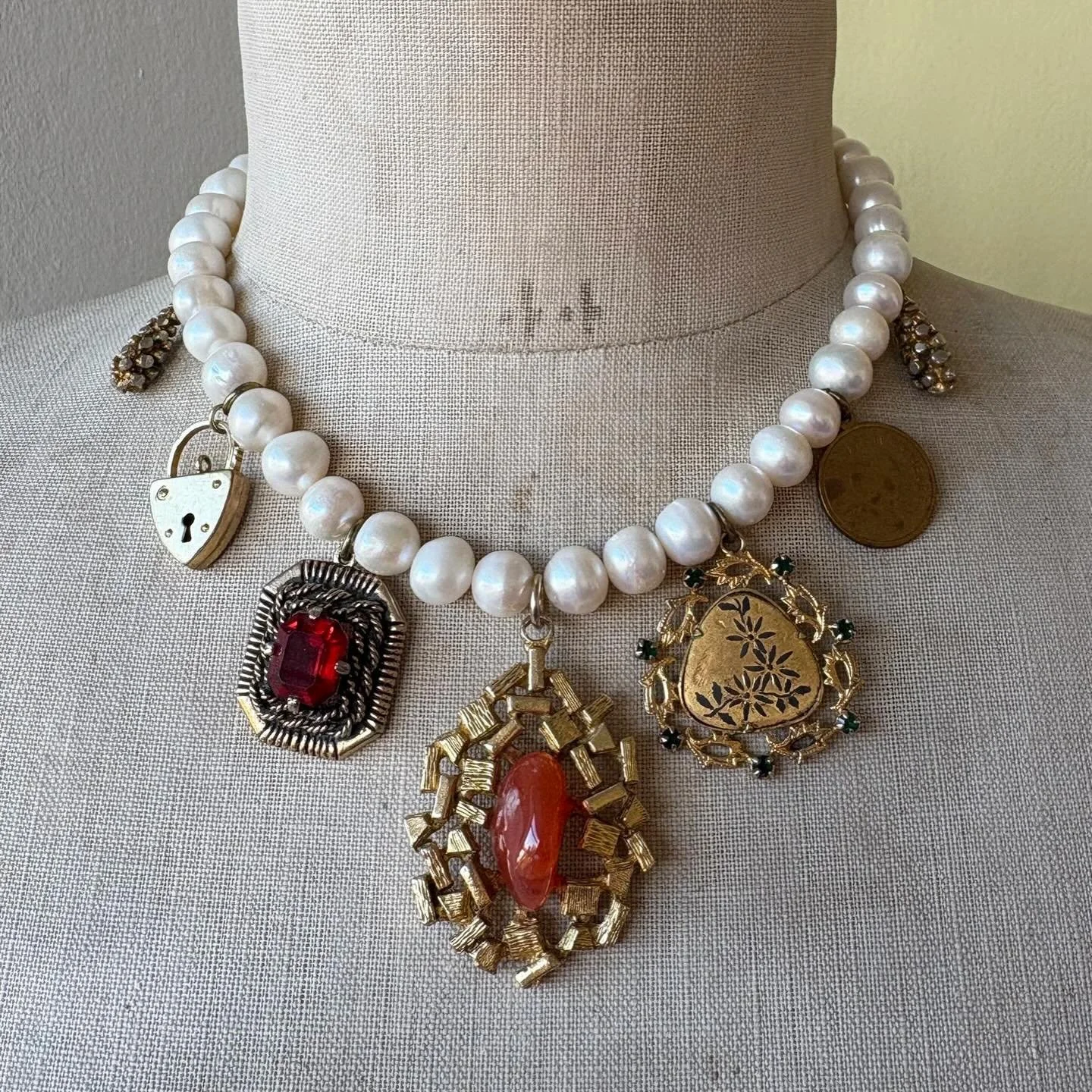 A beautiful selection of one of a kind chunky charm necklaces is available at Shhbysadie.com - made with chunky freshwater pearls and vintage trinkets and charms. They&rsquo;re stunning statement pieces for the party season and one of a kind gift ide