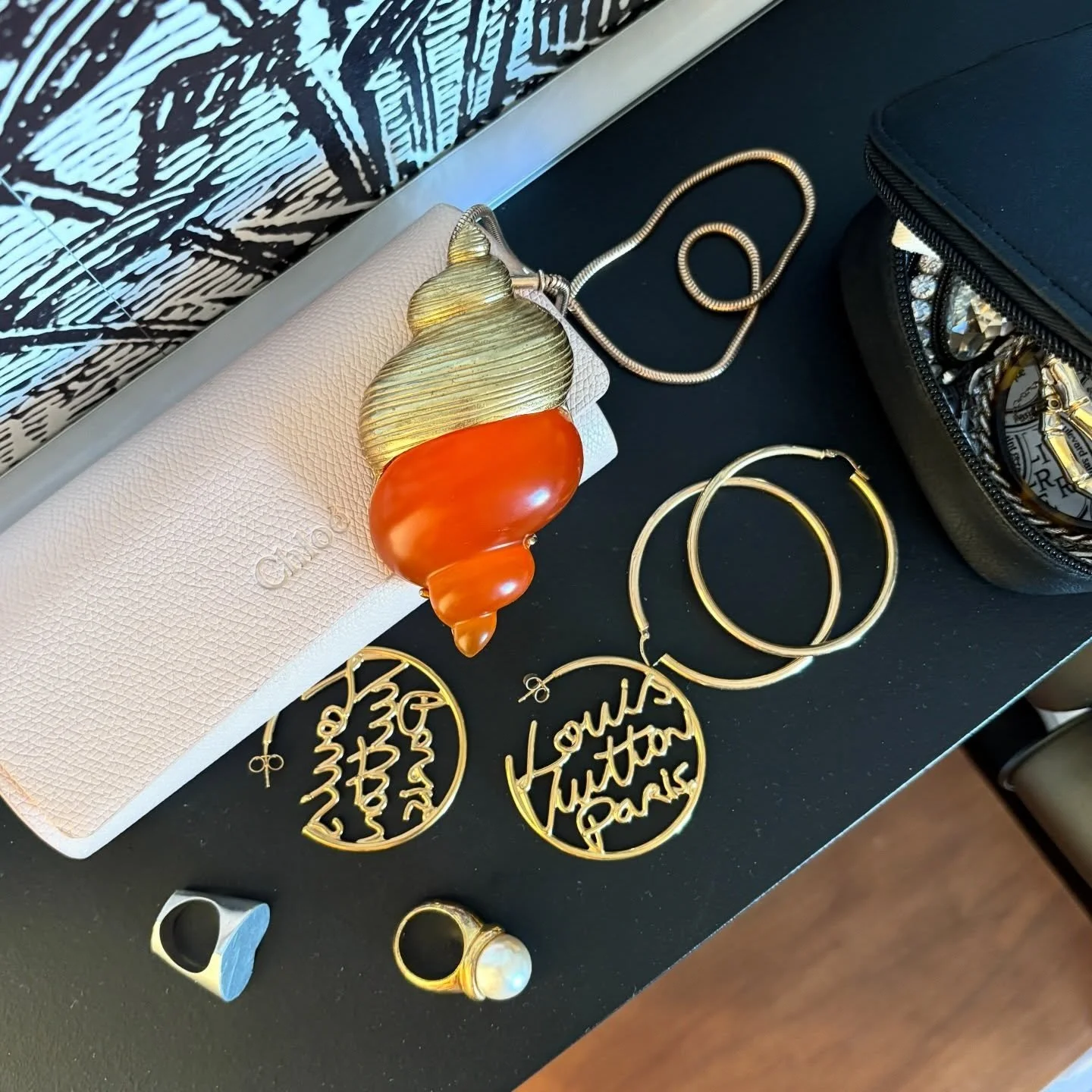 Bijoux in France: 4. I love that jewellery brings us the joy of wearing it as well as the joy of the stories behind it. I bought the big faux pearl ring at a brocante at Chateau Du Loire on this holiday, as well as the giant Christian Dior shell pend