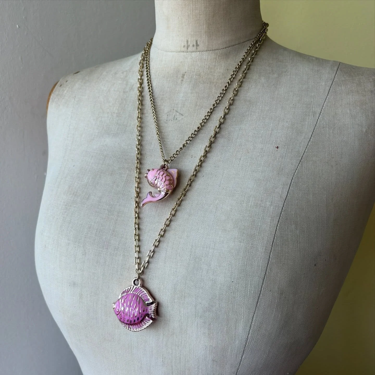 Two [gettit] cute not to share 🥰🐠 Two super fun pink fish necklaces made with vintage pendants and vintage chains. The short necklace has sold but the longer fishie is still looking for a new home 🥰