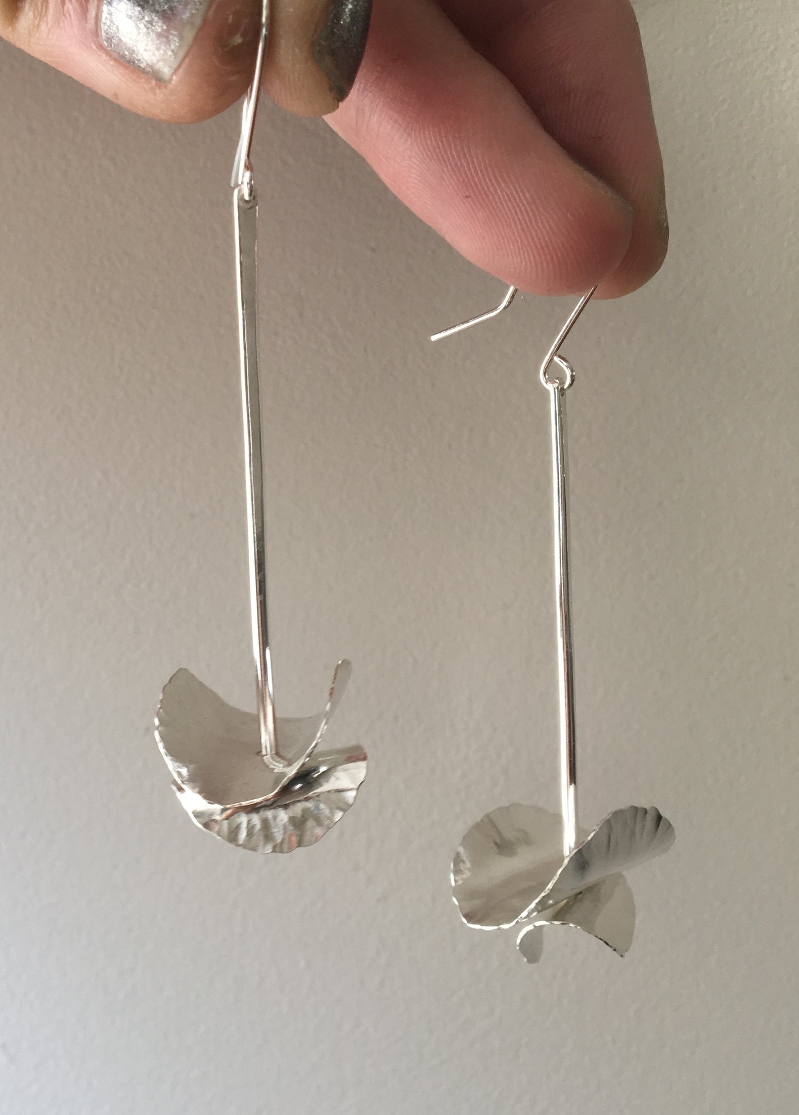 silver dangling petal earrings