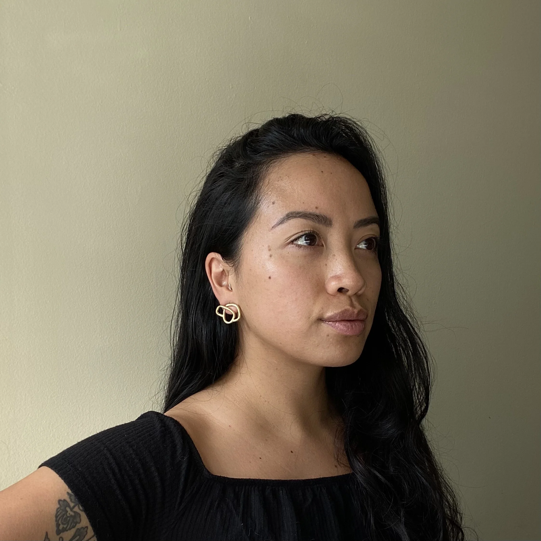 woman modelling cast bronze knot earring