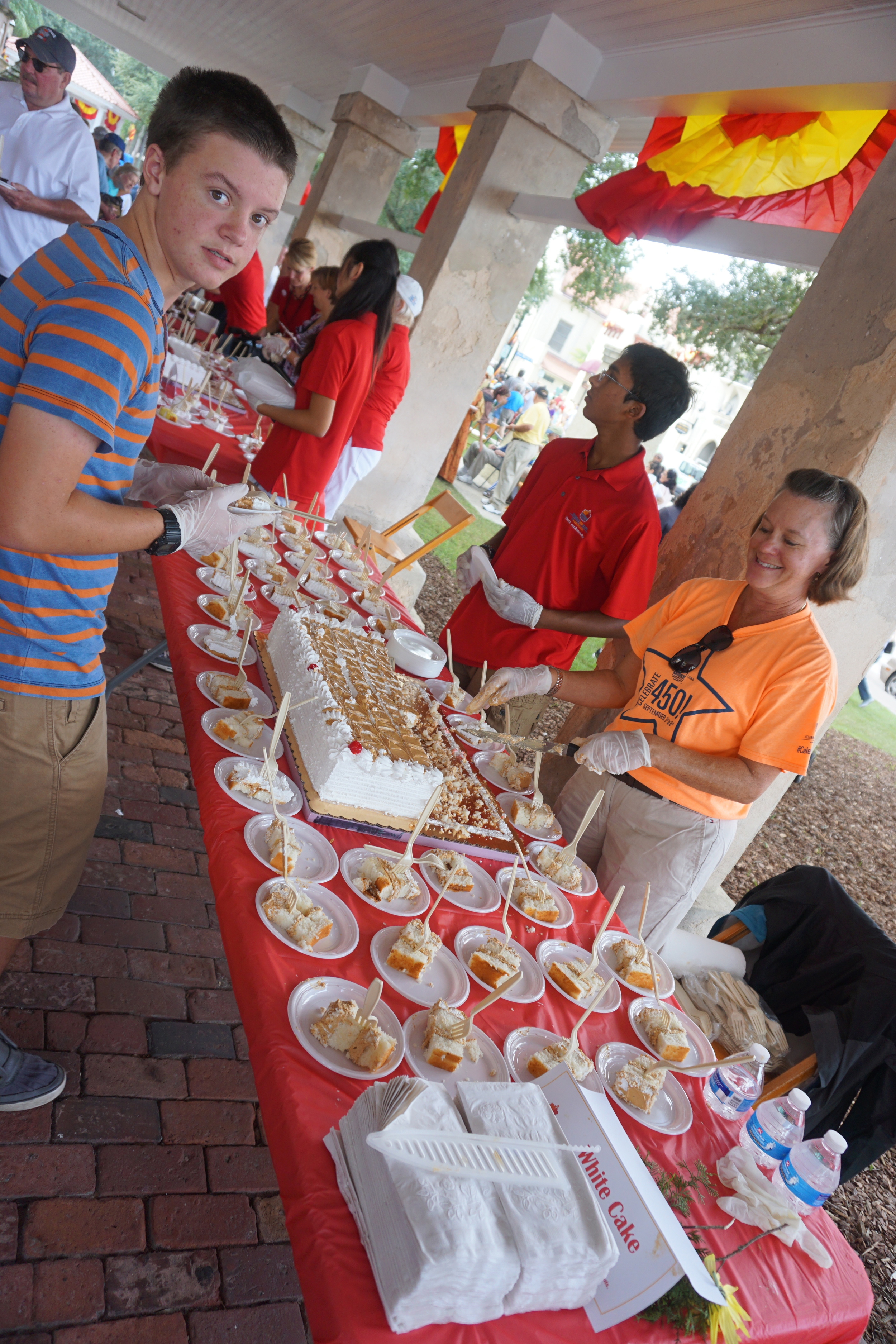  Serving sheet cake for the 450th. Photo by Daniel Ward. 