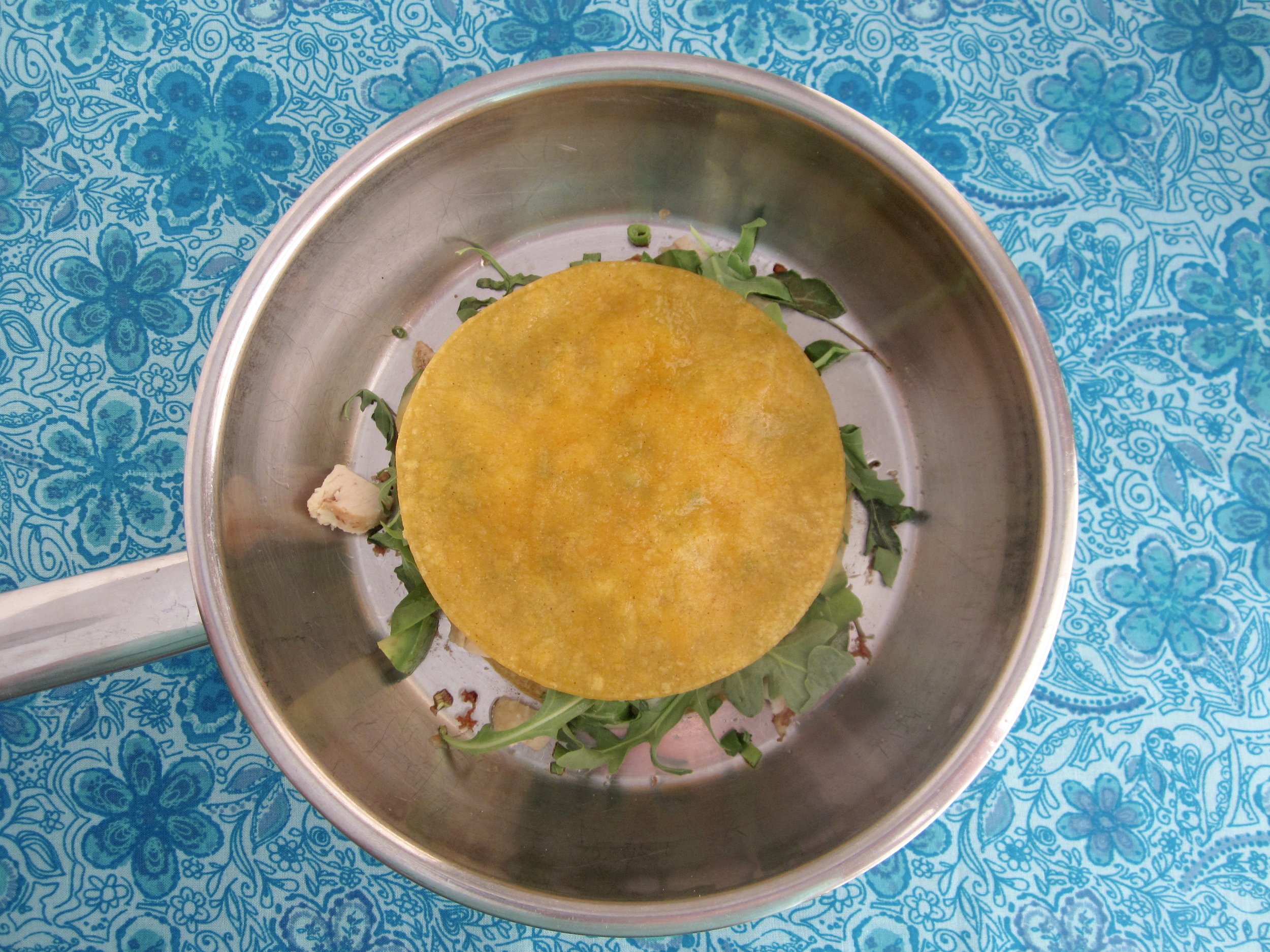 The finished product! Crispy tortilla, melted cheese, and tasty fillings, ready for your avocado garnish.