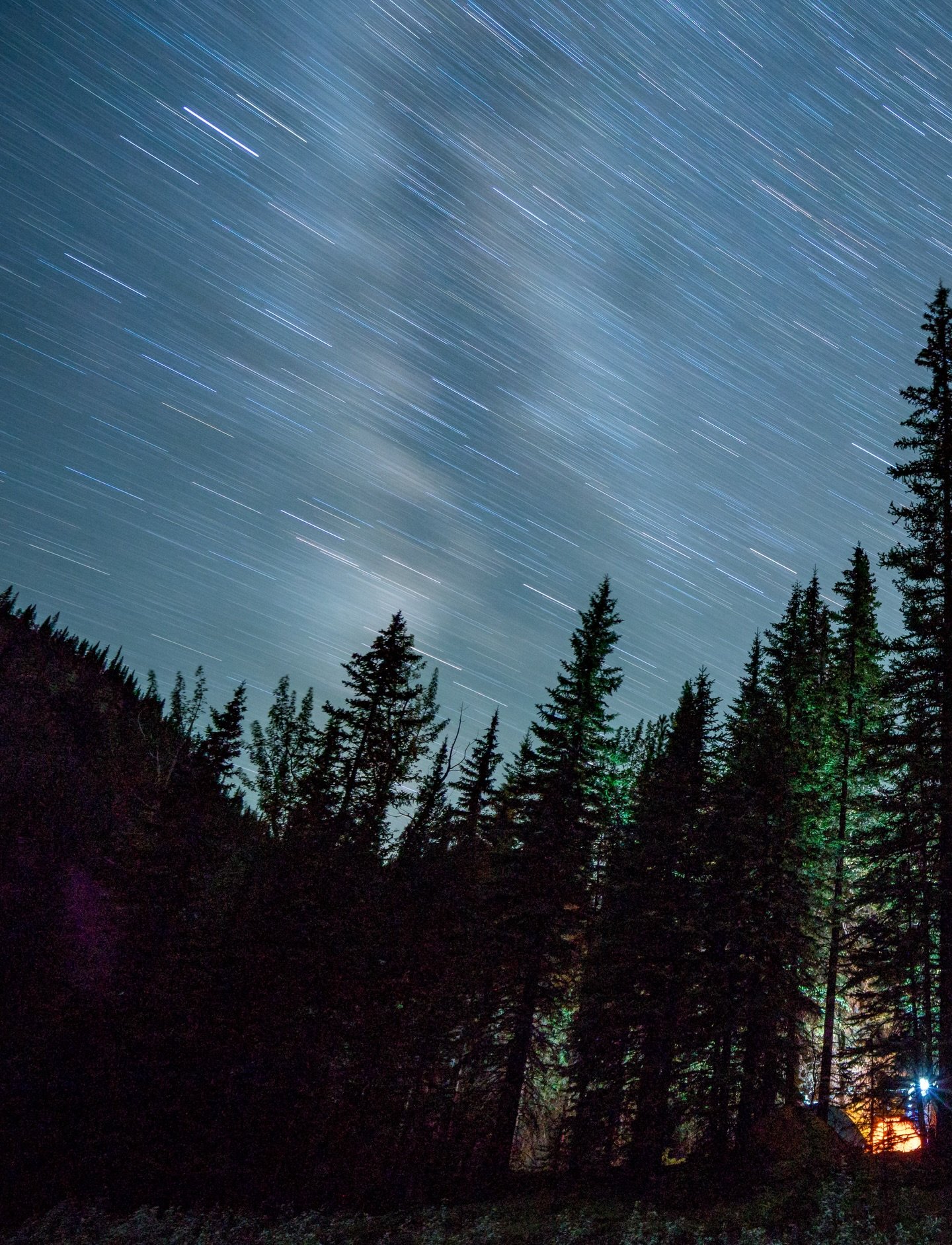 The fire settles and the mountains go quiet. Stars stacked so deep it feels like time is sitting right beside me. A river moving through the dark, fossils in its banks older than memory, older than every story we&rsquo;ve ever told.

Morning comes co