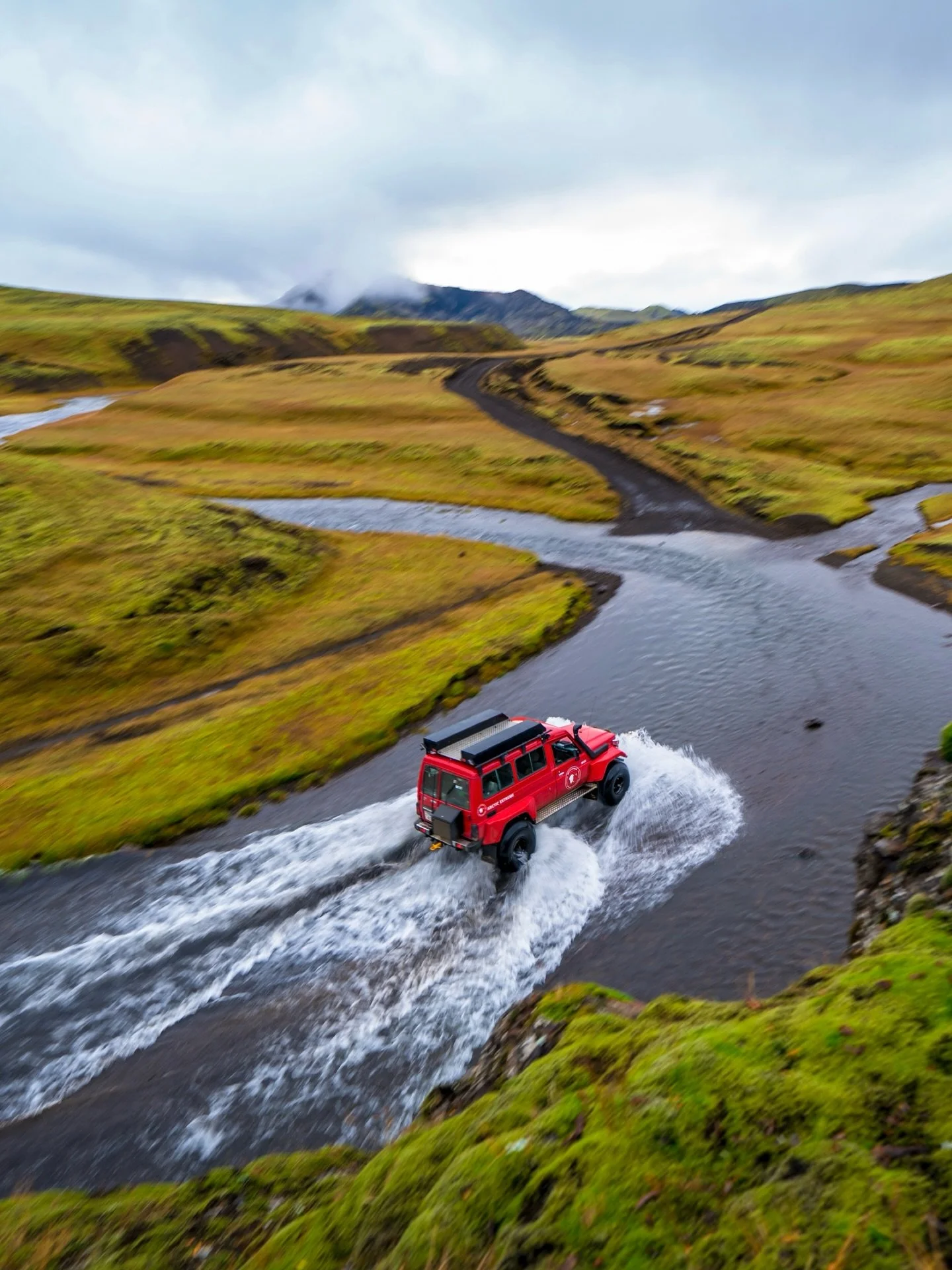 BEFORE the crowds, we crossed the interior of Iceland from south to north by super jeep.

A narrow track threading through black sand and neon moss, the air sharp with cold and the mineral scent of wet stone. Glacial ice rising in blue, fractured wal