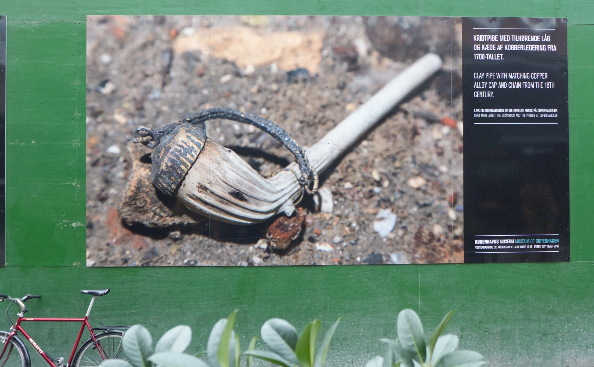 Photograph on the hoardings around engineering work for the extension to the Metro showing finds from Gammel Strand 