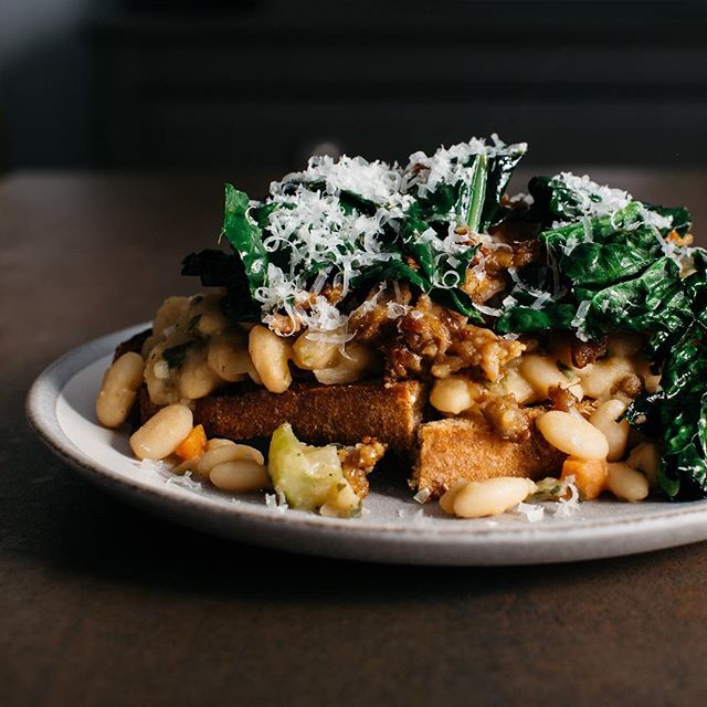 Keeping it simple and herby tonight with Ina Garten&rsquo;s Proven&ccedil;al beans + spicy Italian sausage &amp; kale on toast.