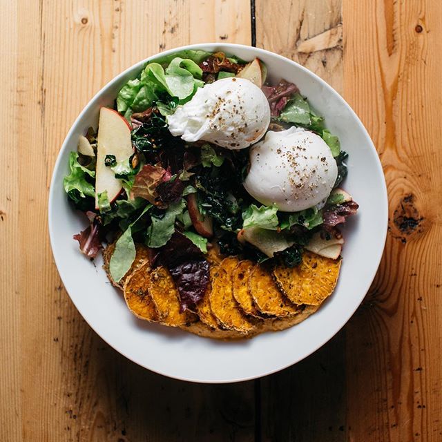 Nothing like a kitchen sink salad for dinner. This one has an ingredients list you won&rsquo;t believe - seasoned sweet potatoes on homemade roasted red pepper hummus, mixed greens from @tgfarmersmarket with apple slices and kale tossed in hot shallo