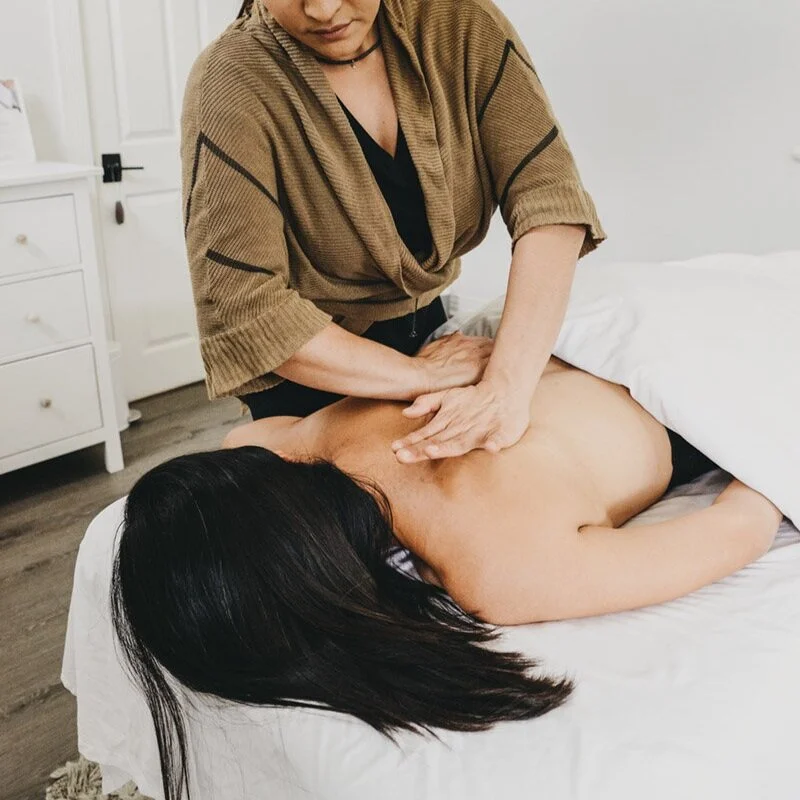A massage therapy session at Saffron & Sage
