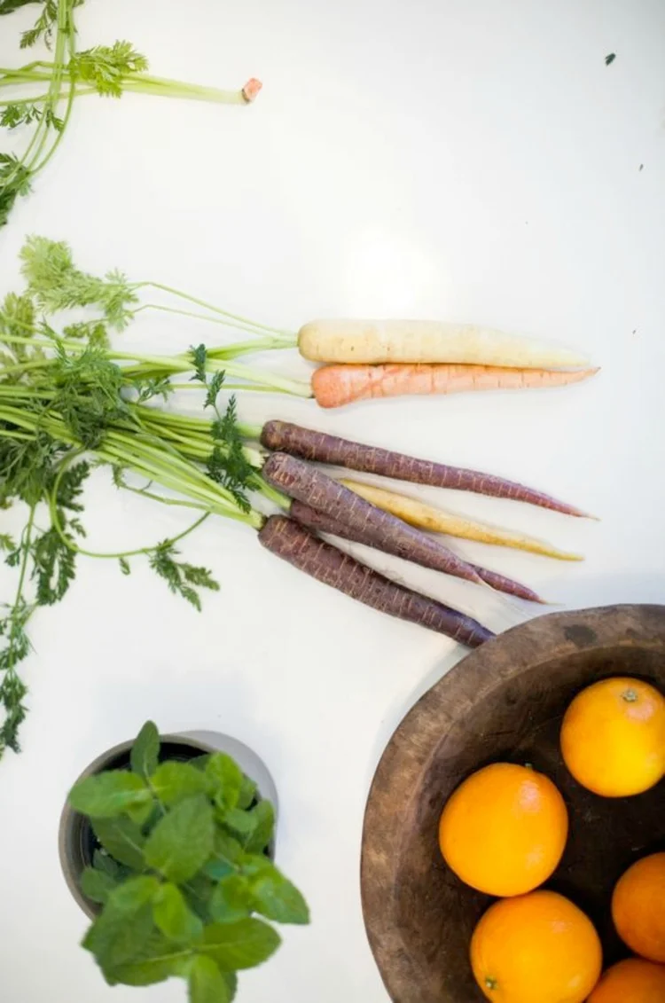 Fresh carrots, herbs and oranges