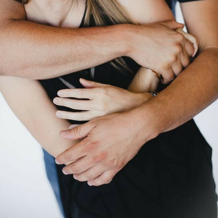 Two people holding each other
