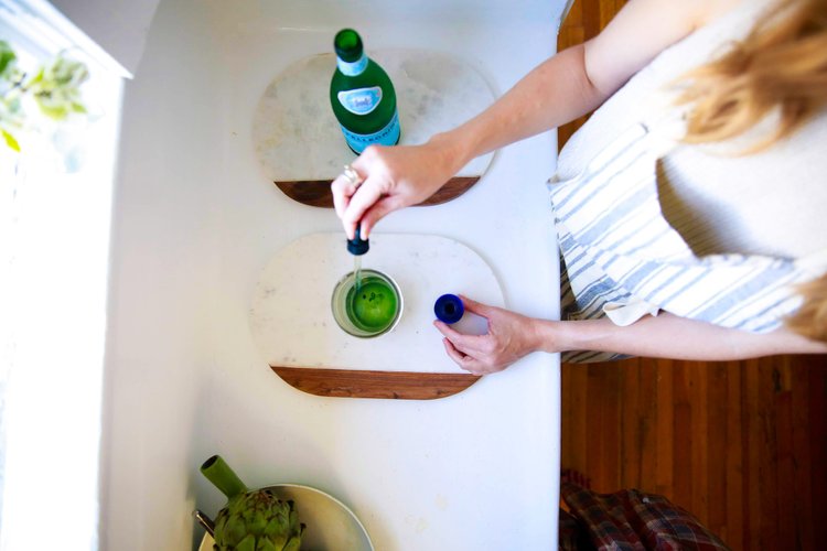 Pouring a glass of water at the table
