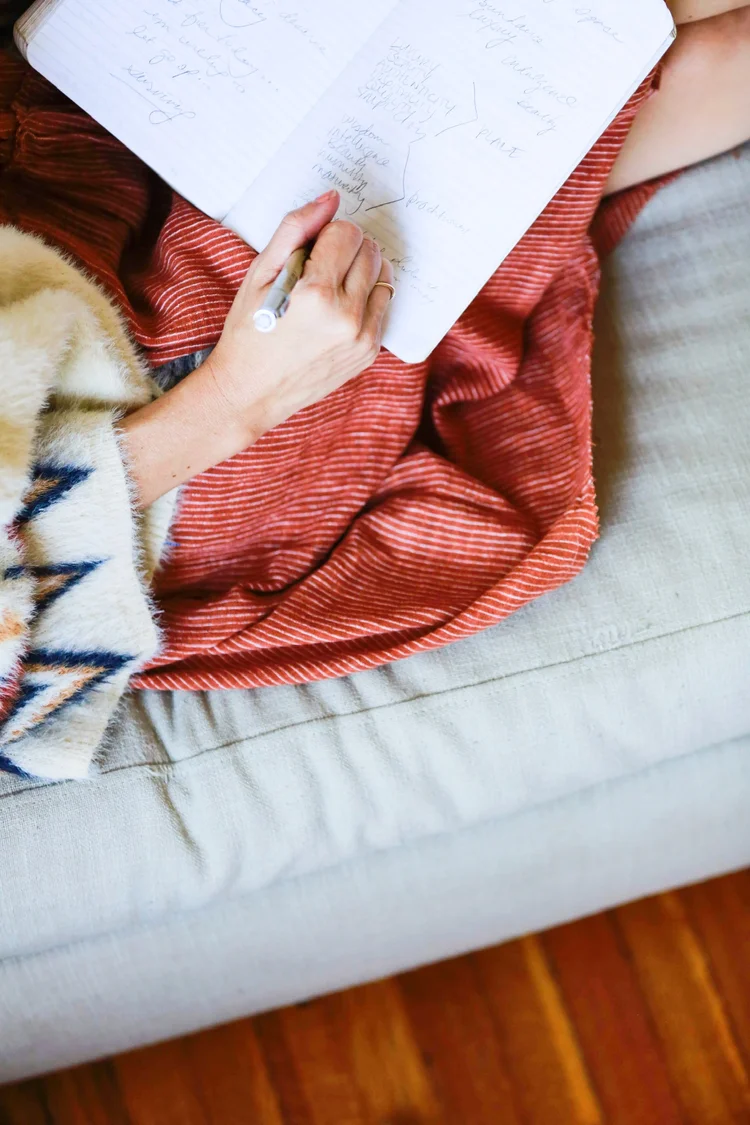 Writing notes on the sofa