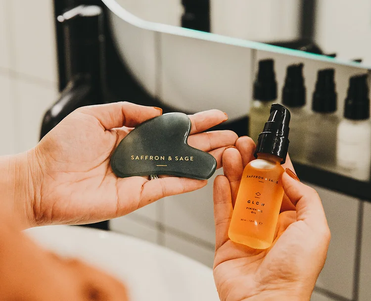 A gua sha stone and facial oil
