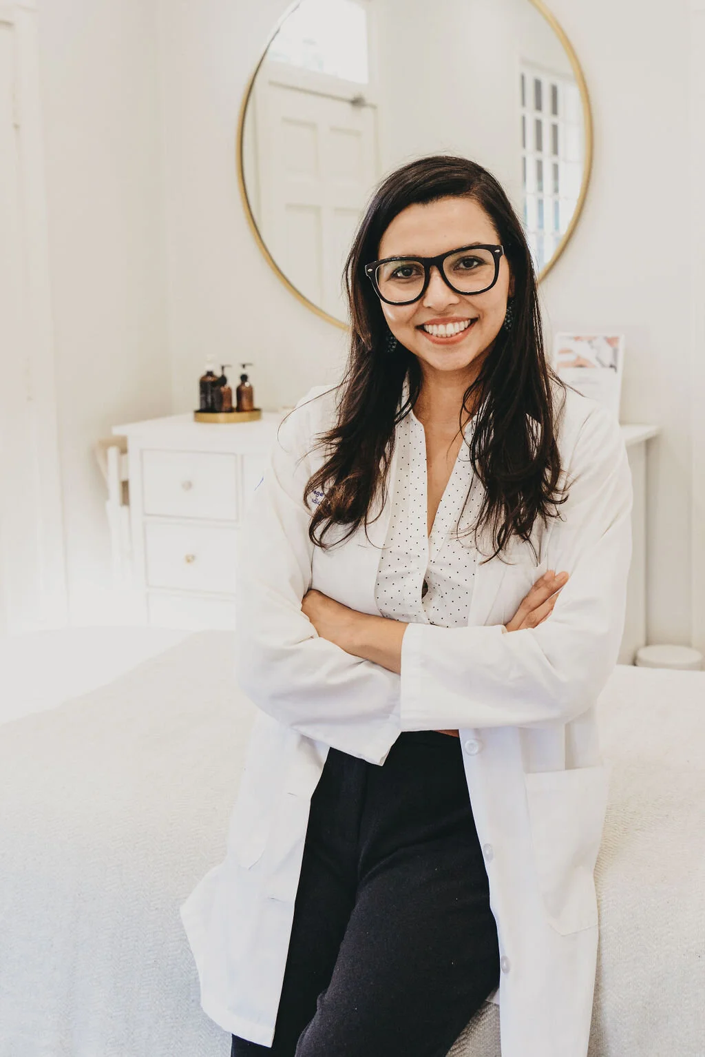 A smiling Saffron & Sage doctor in the clinic