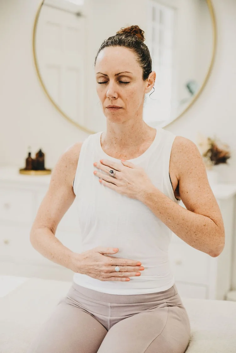 Qi gong with a hand on the belly