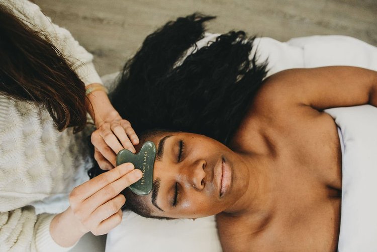 A Saffron & Sage esthetician giving a relaxing facial in San Diego
