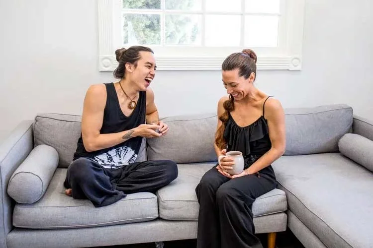 Two people talking at Saffron & Sage