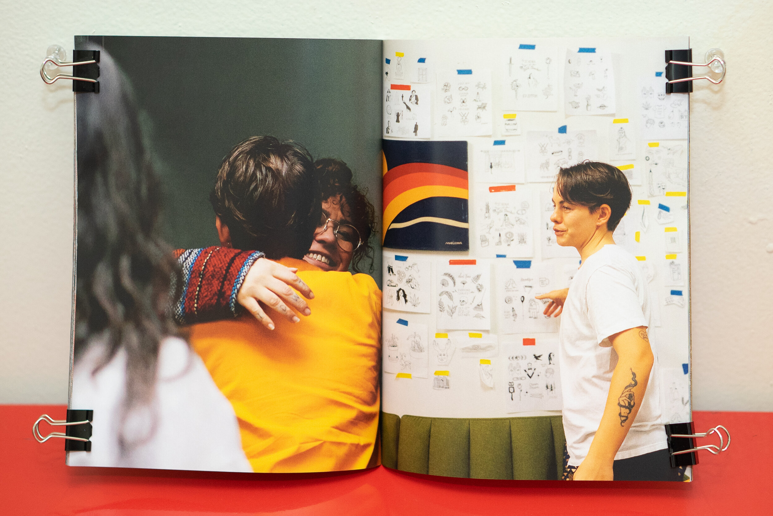  left - Leo Baker and his partner Mel are greeted at @st.kenia’s studio. right - Leo picks out his tattoo design from @st.kenia’s studio wall. 