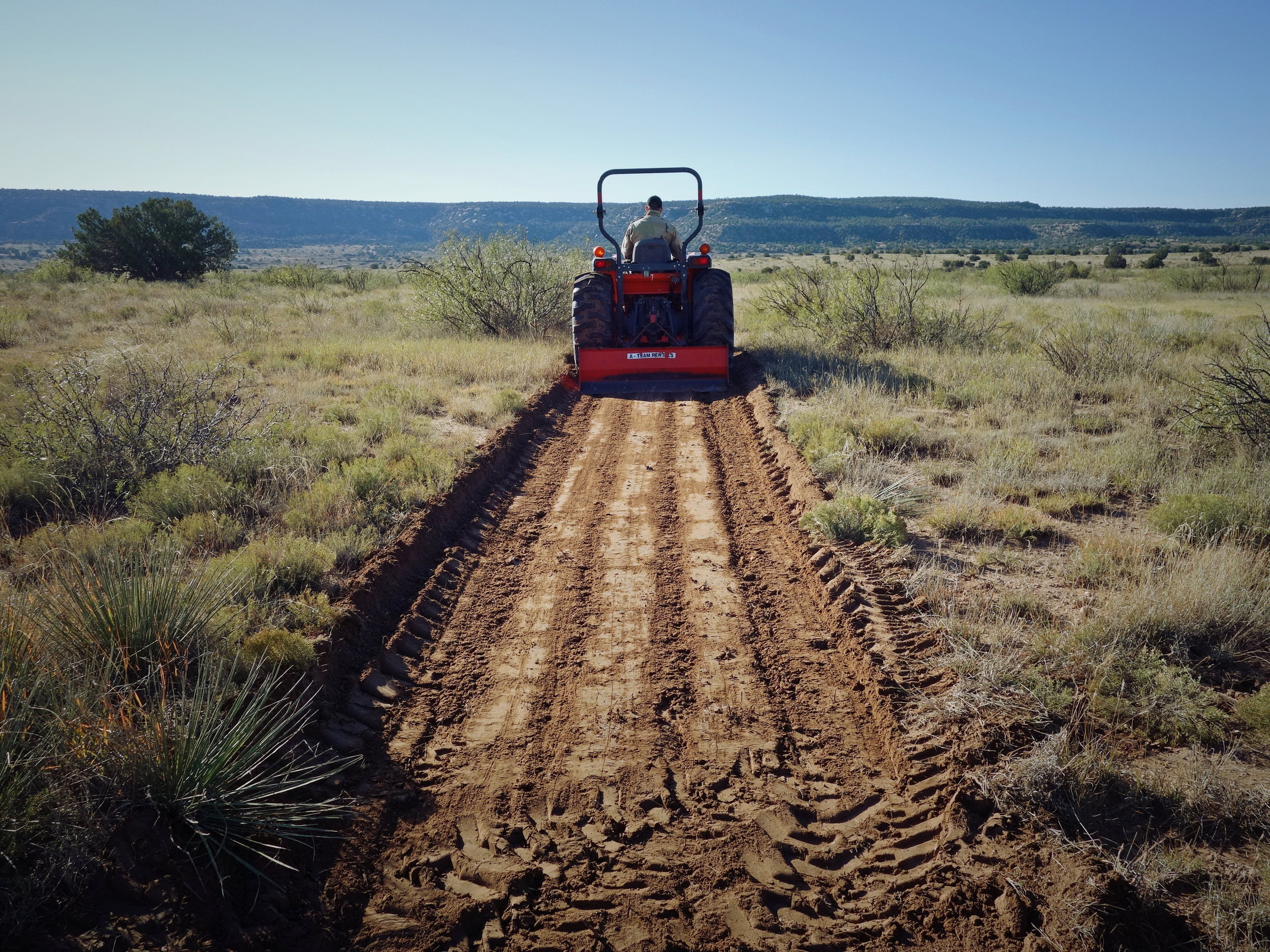 Excavating a half-mile driveway. 