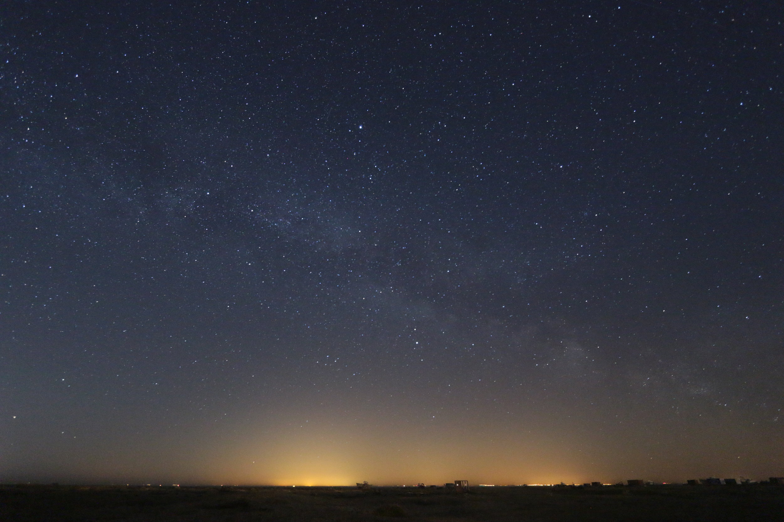 Milky way over Dungeness with the light pollution of France