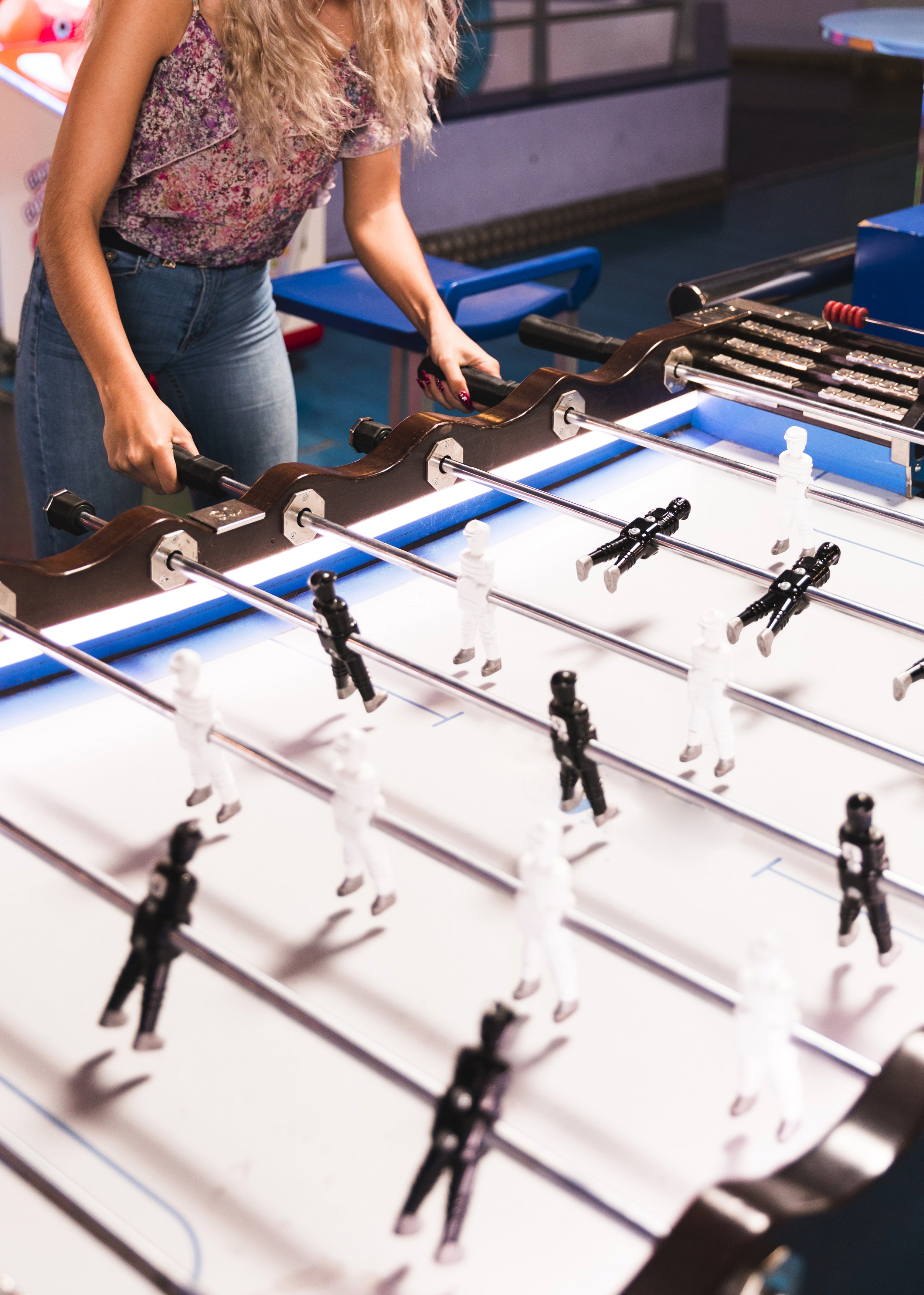 high-view-woman-playing-foosball.jpg