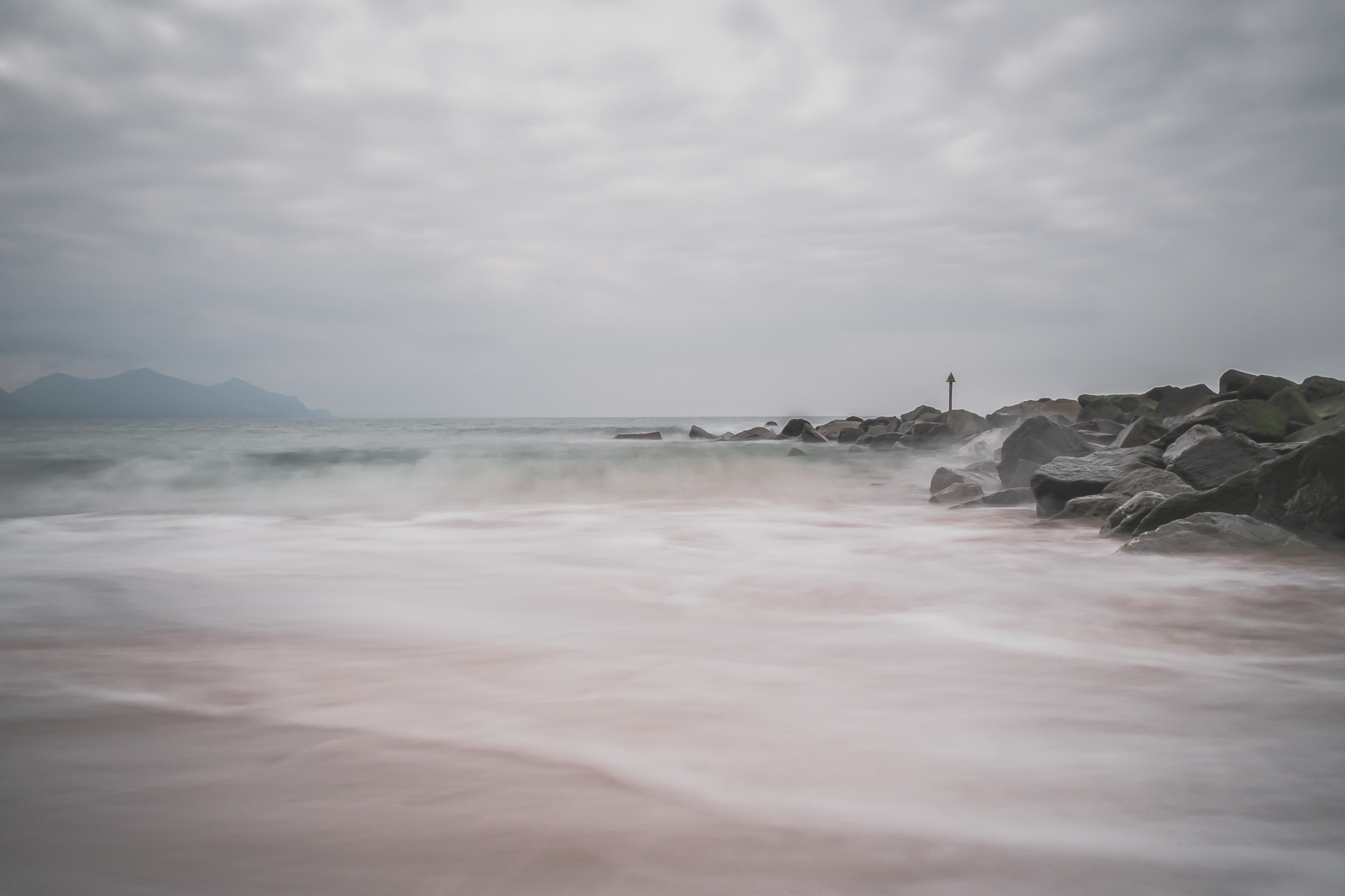 Dinas Dinlle - X-Pro1 + 18mm f/2 & B+W 110 ND Filter @ f/16. ISO200. 3.2 second exposure.