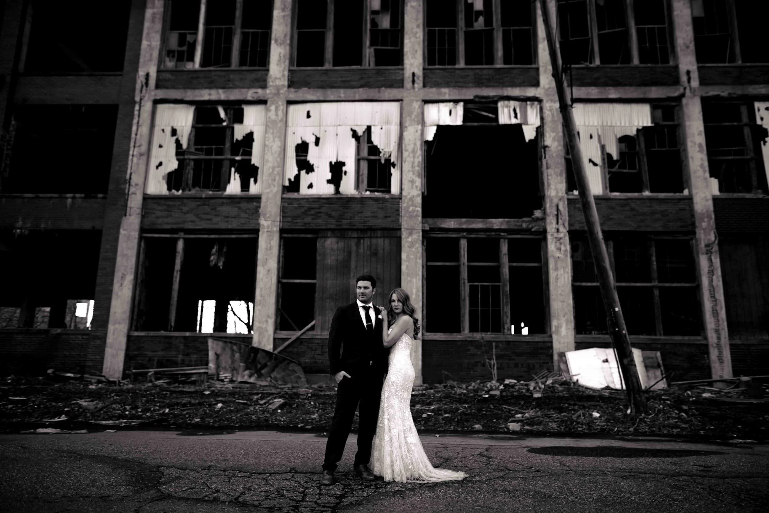 Editorial-style Detroit wedding photo in front of a destroyed building