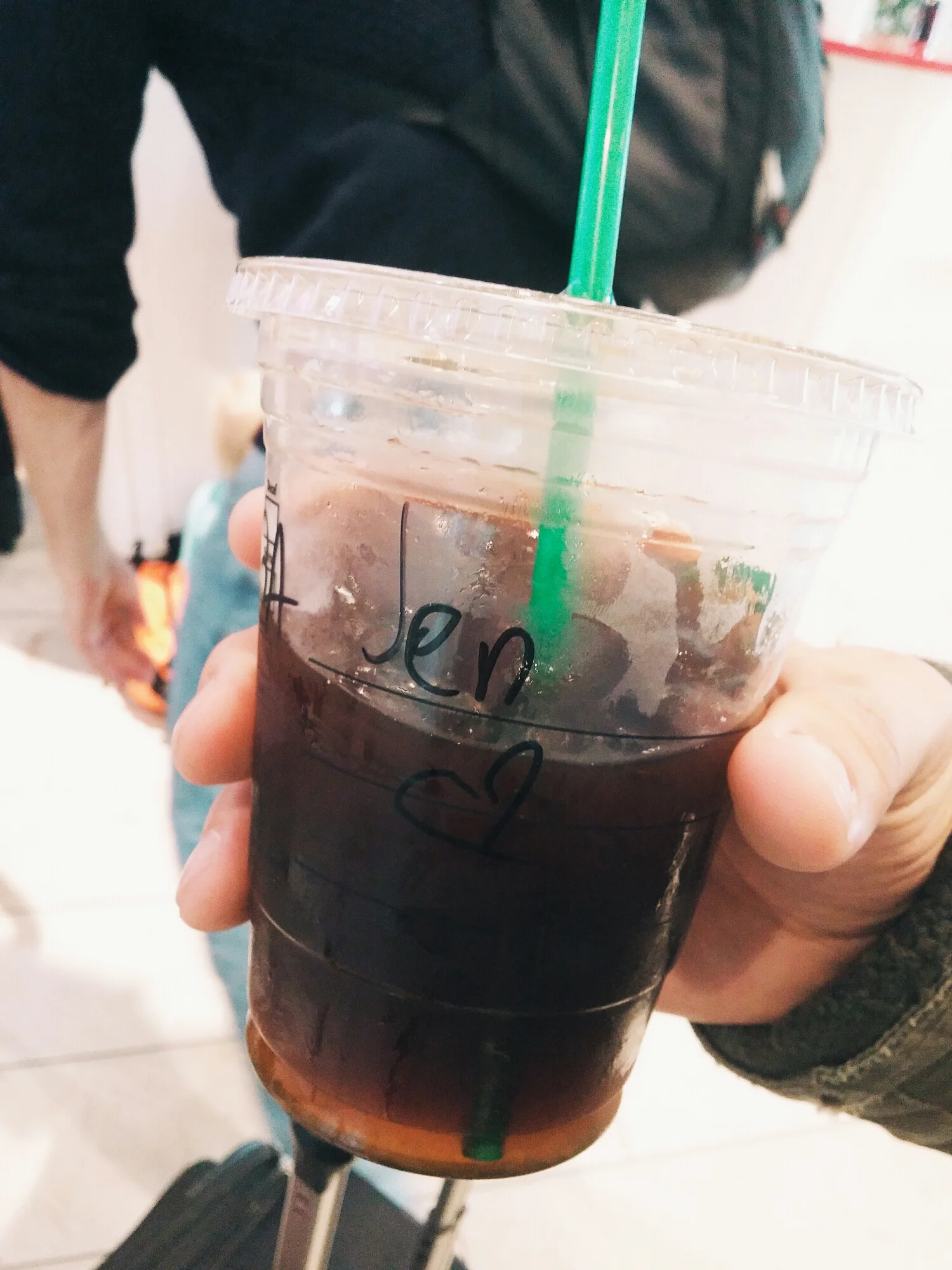 {My $11 Iced Americano. Sigh. At least they drew me a little heart on the cup.}