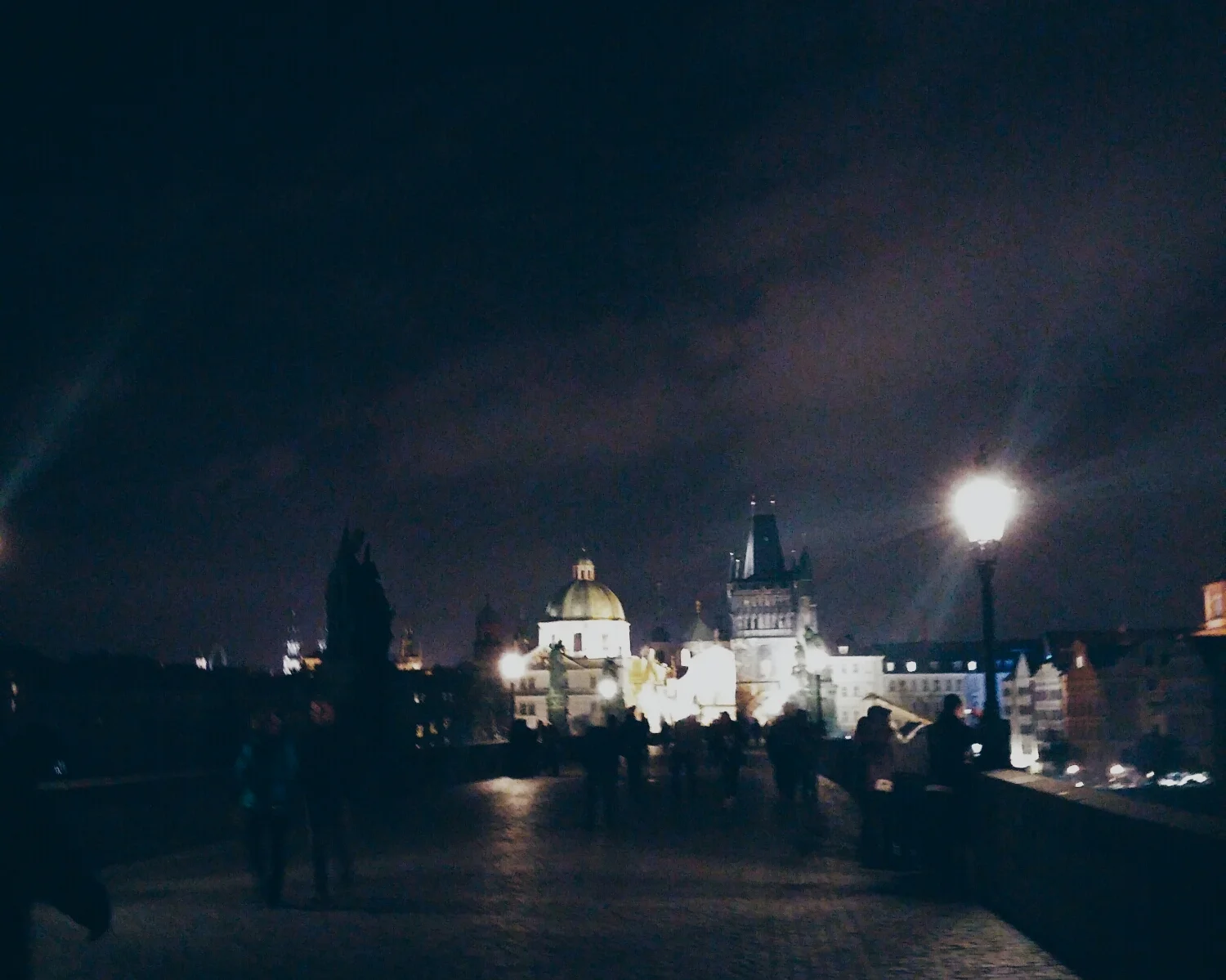 {Charles Bridge at night.}