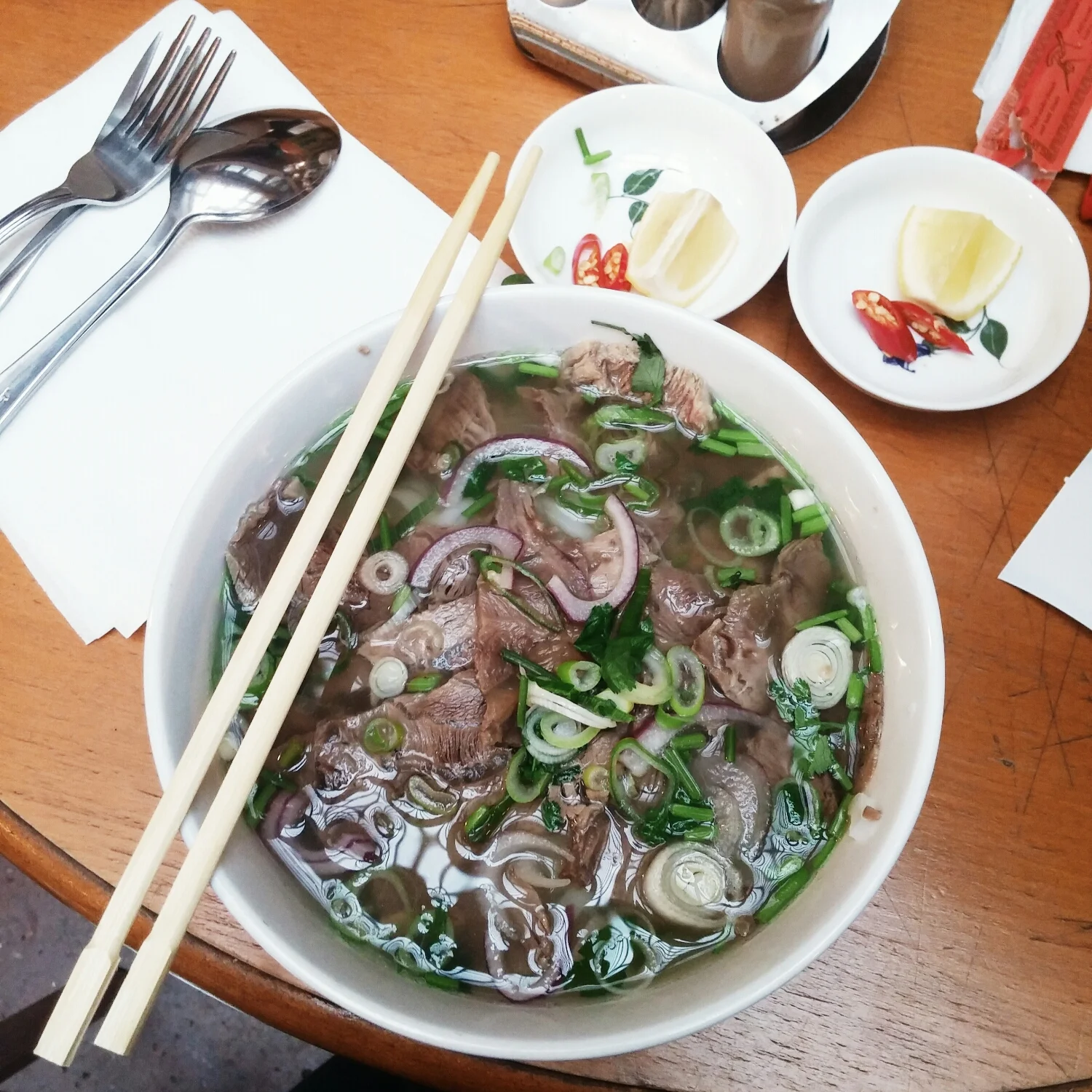 {What's a vacation without a bowl of pho? And a beer of course.}